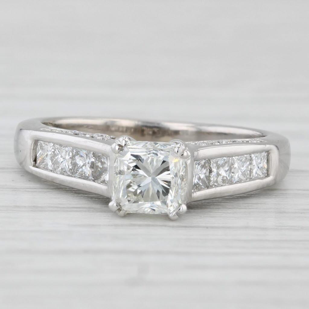 Gemstone Information:
- Natural Princess -
Carats - 0.84ct 
Cut - Princess (modified Square Brilliant)
Color - K
Clarity - SI1 

- Natural Diamonds -
Total Carats - 0.52ctw
Cut - Princess Brilliant
Color - G - H
Clarity - VS2 - SI1

- Natural