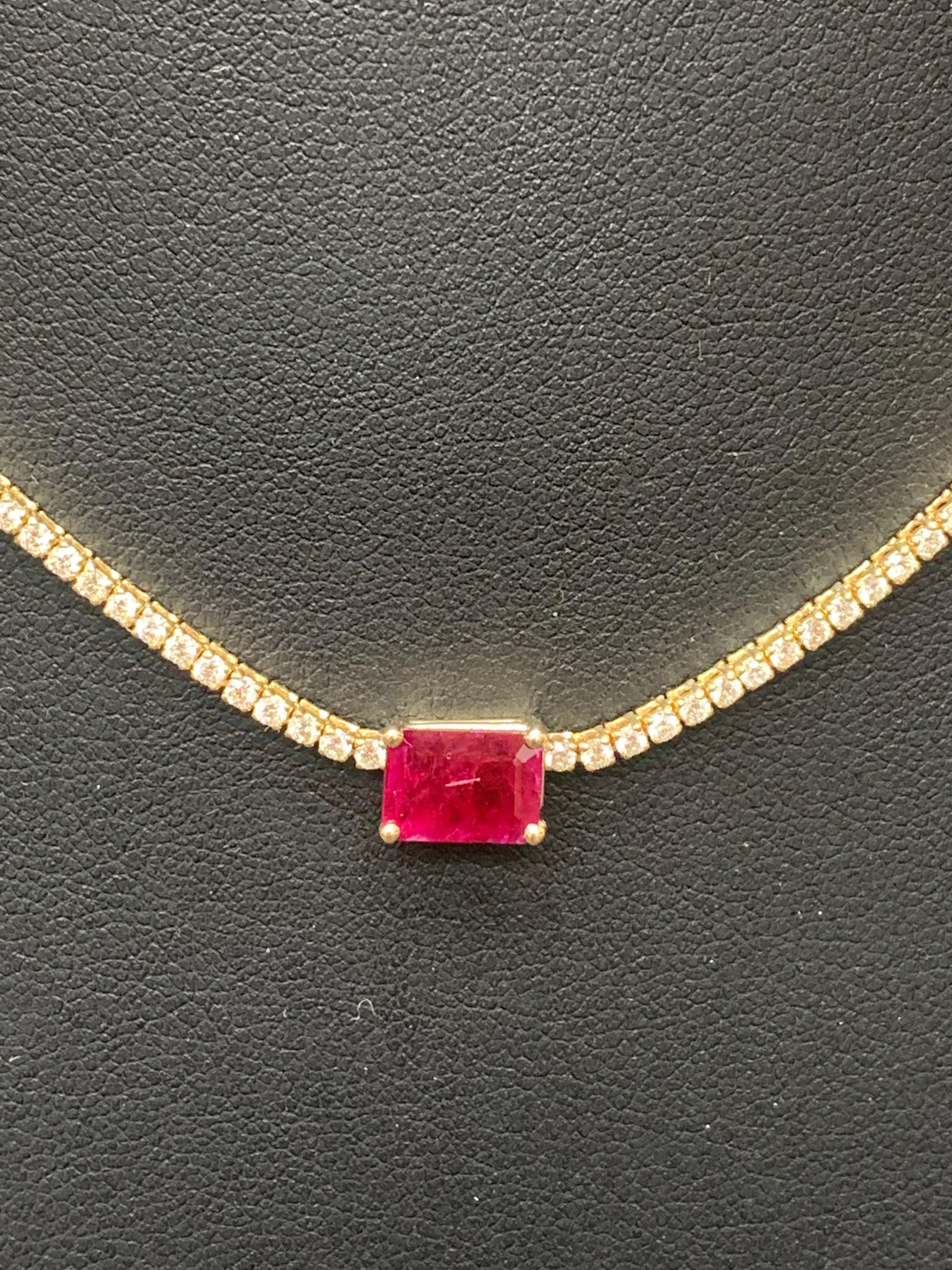 A brilliant and classic piece showcasing emerald cut red ruby in the center weighing 1.49 carats and a line of round diamonds on both sides set in 14K White Gold. 239 diamonds in this necklace are brilliant round cut and weigh 3.01 carats in total.