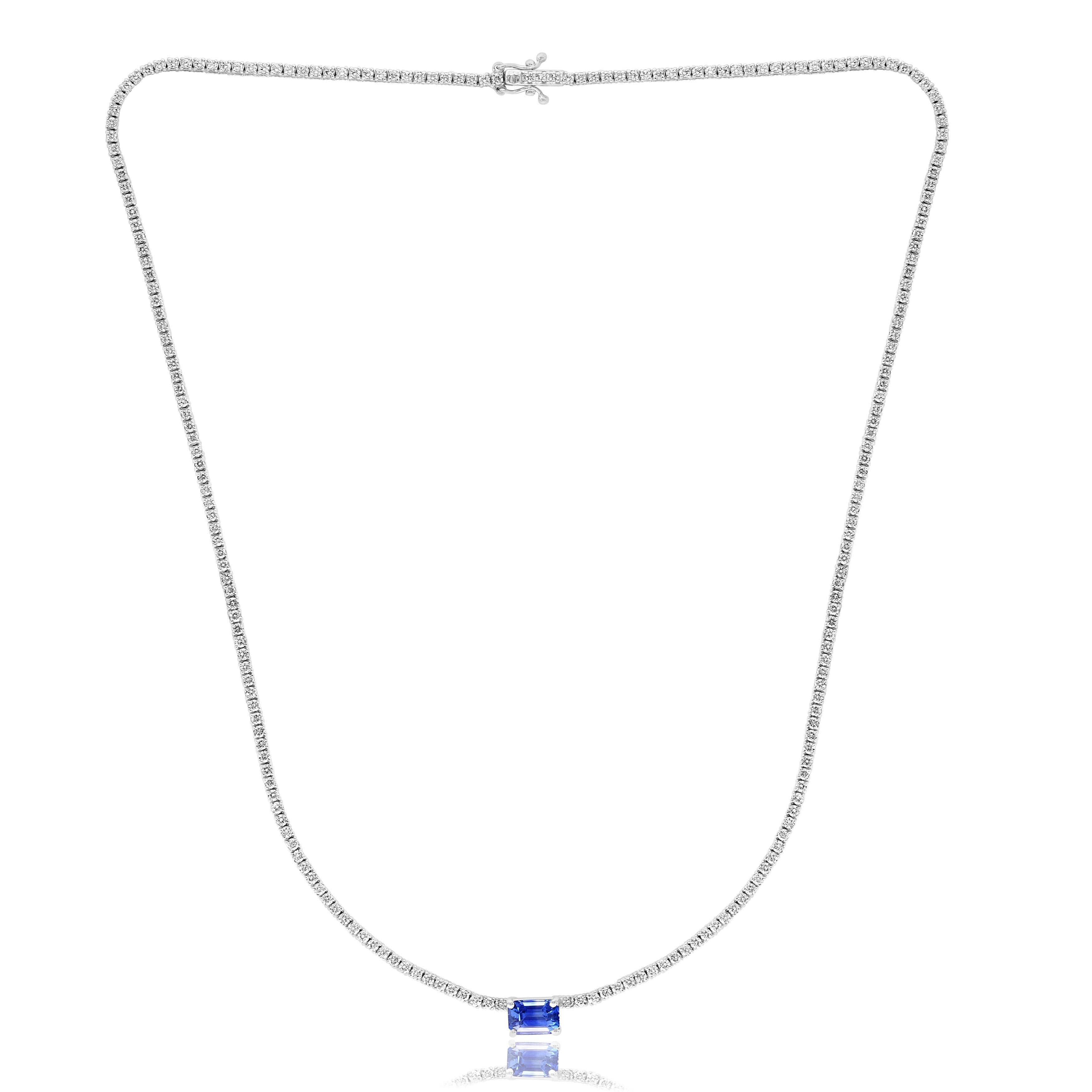 A brilliant and classic piece showcasing emerald-cut Blue Sapphire in the center weighing 1.49 carats and a line of round diamonds on both sides set in 14K White Gold. 216 diamonds in this necklace are brilliant round cut and weigh 3.01 carats in