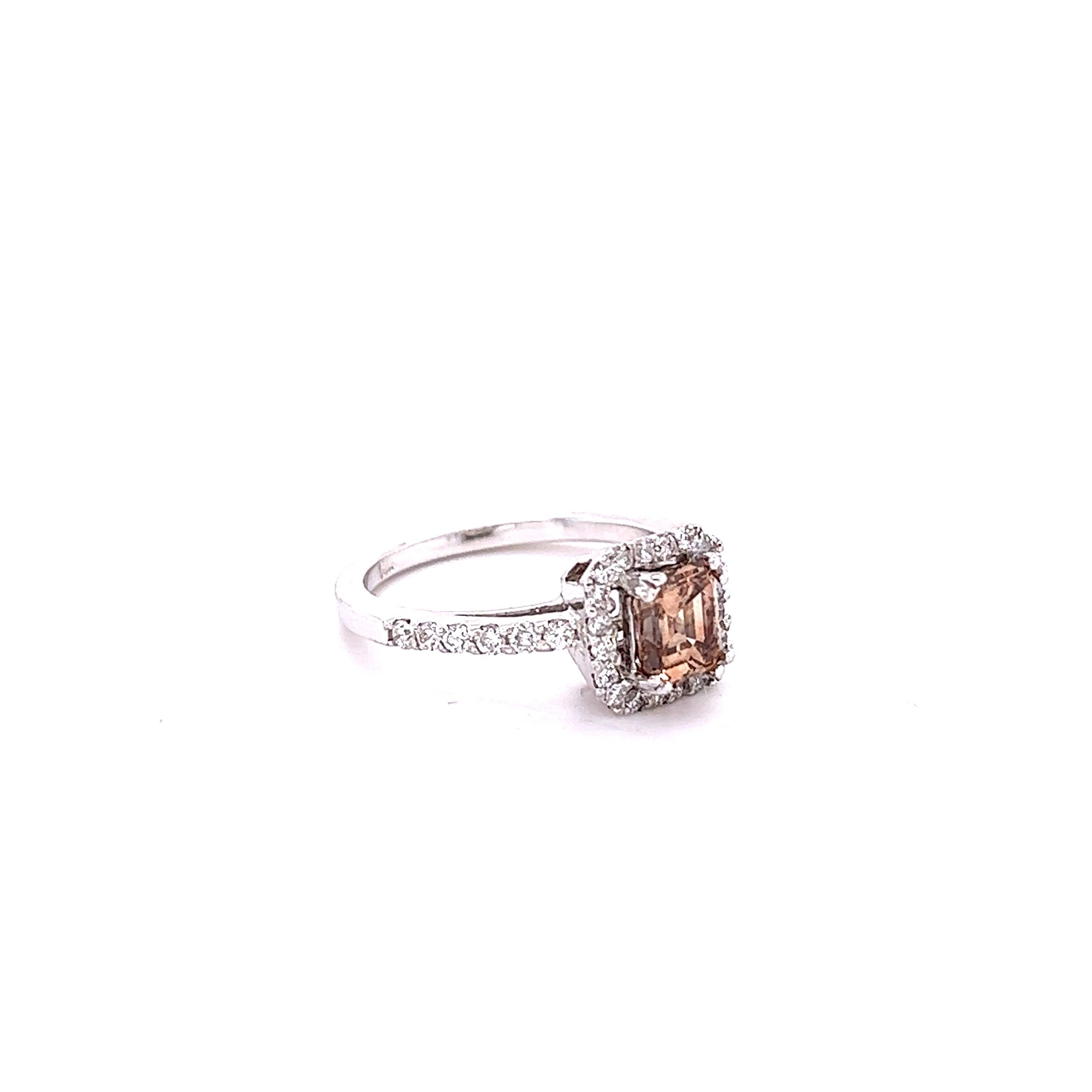 This ring has a Natural Asscher Cut Champagne Brown Diamond that weighs 1.01 carats and it is surrounded by 34 Round Cut White Diamonds that weigh 0.48 carats. Clarity: VS, Color: F
The center champagne diamond measures at 6 mm x 5 mm. 
The total