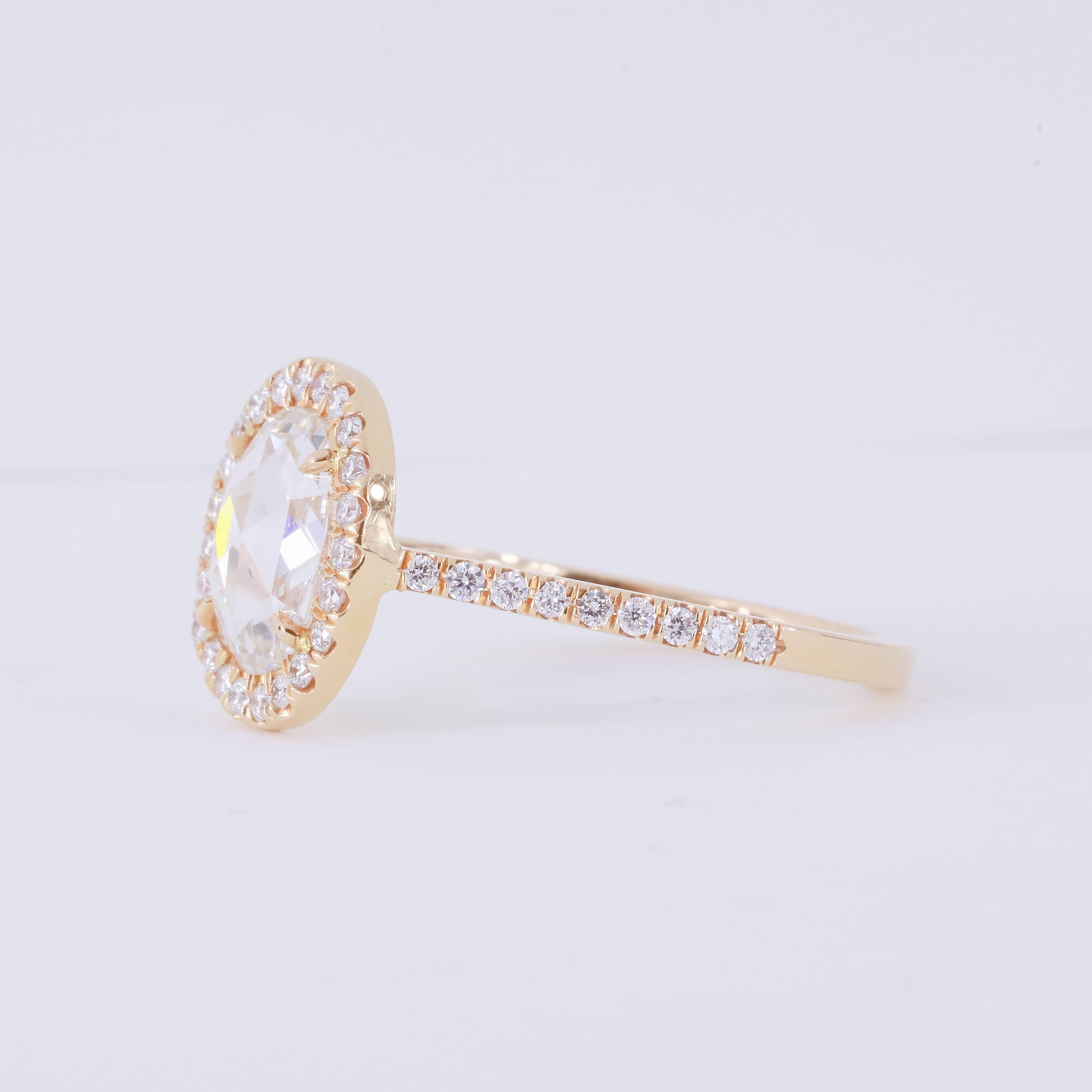 Oval Rose cut diamond diamond ring with 1.49 ct F VS center
Round diamond melee 0.31 tw (41 stones)
18k rose gold
Size 6.5