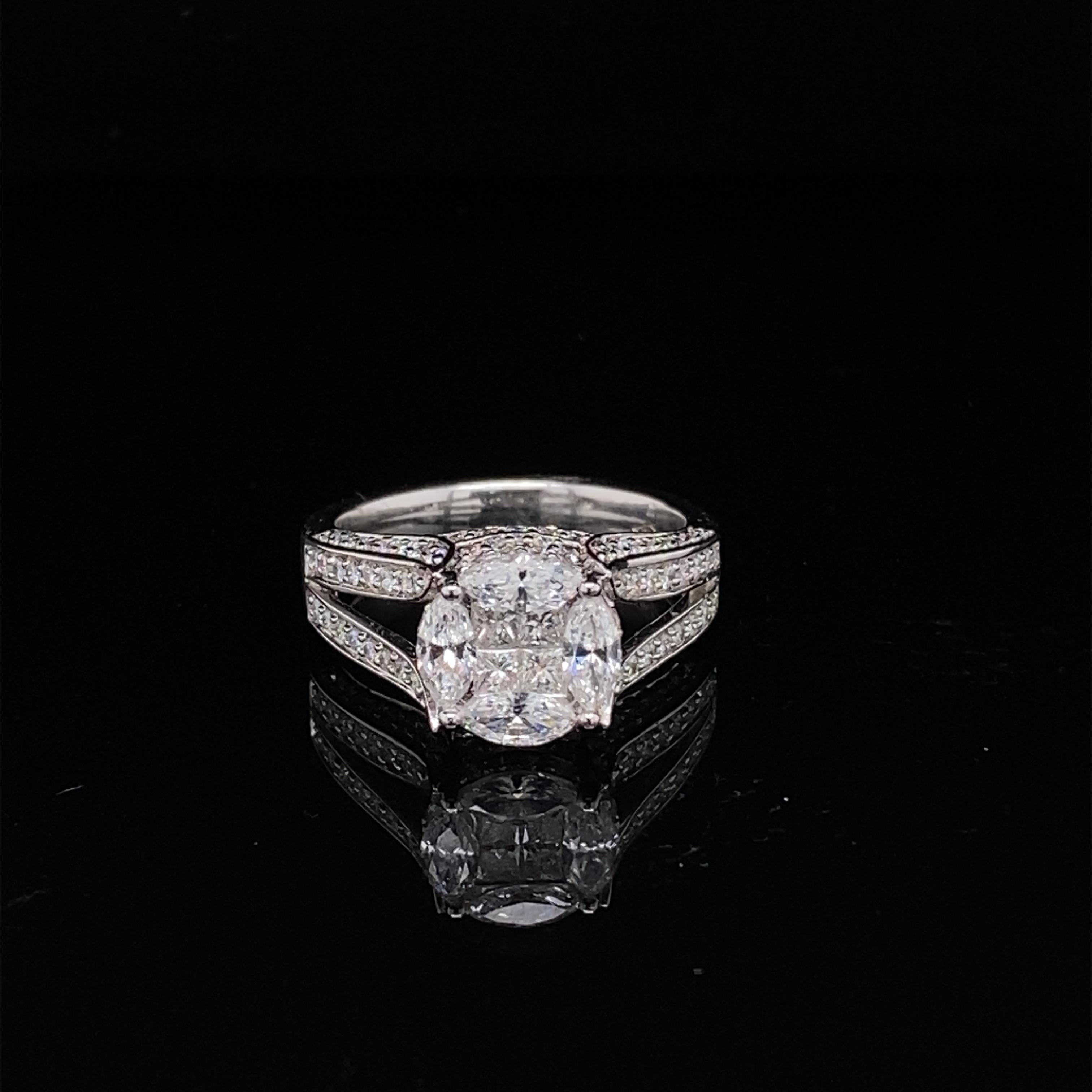 This stunning ring features a beautiful Round Cluster of White Diamonds comprising of 4 marquise diamonds and 4 princess cut diamonds. The Round Cluster sits on a Double Diamond Shank. This ring is set in 18K White Gold.
Total Diamond Weight = 1.49
