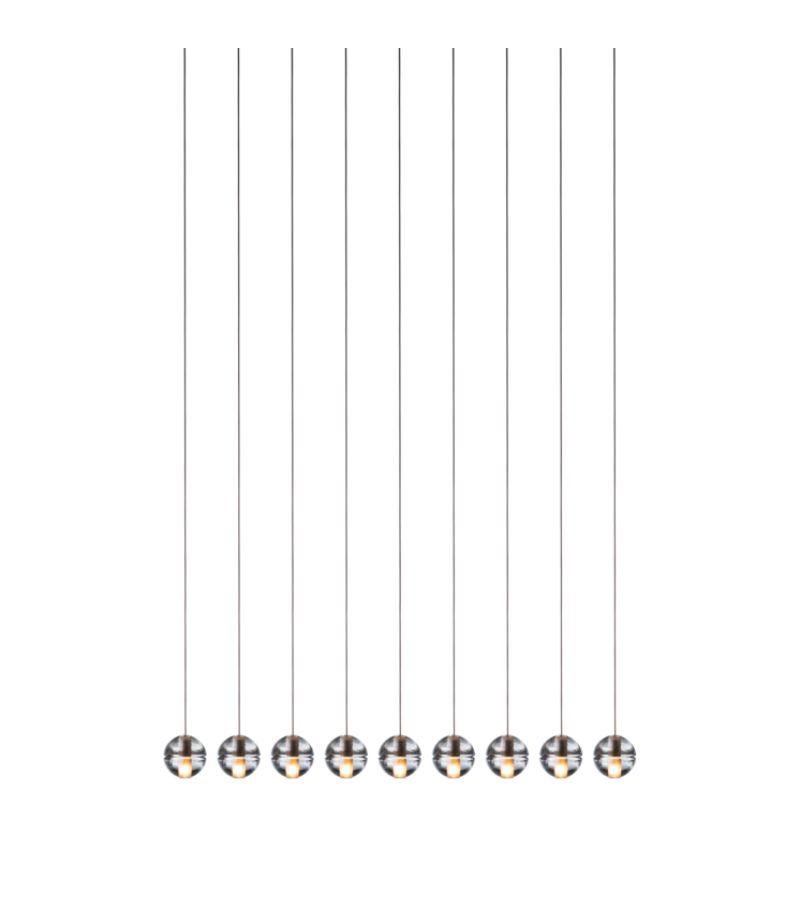 14.9 Chandelier lamp by Bocci.
Dimensions: D 22.4 x W 120 x H 300 cm 
Materials: Brushed nickel, cast glass, blown borosilicate glass, braided metal coaxial cable, electrical components, white powder-coated canopy.
Also sold individually and in