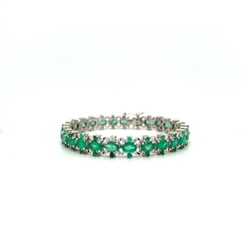 Beautifully handcrafted silver Art Deco Emerald Statement Tennis Bracelet, designed with love, including handpicked luxury gemstones for each designer piece. Grab the spotlight with this exquisitely crafted piece. Inlaid with natural emerald
