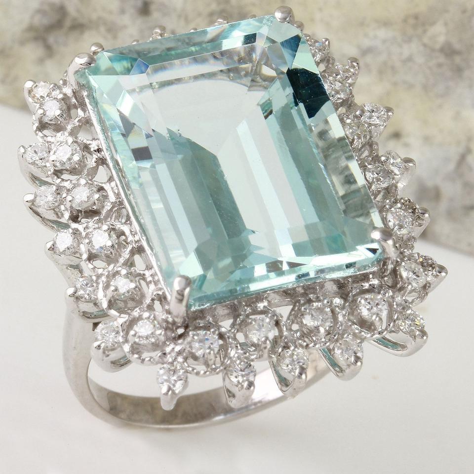 14.90 Carats Natural Aquamarine and Diamond 14K Solid White Gold Ring

Total Natural Emerald Cut Aquamarine Weights: 14.00 Carats

Aquamarine Measures: 18.18 x 13mm

Natural Round Diamonds Weight: .90 Carats (color G / Clarity VS2-SI1)

Ring size: 7
