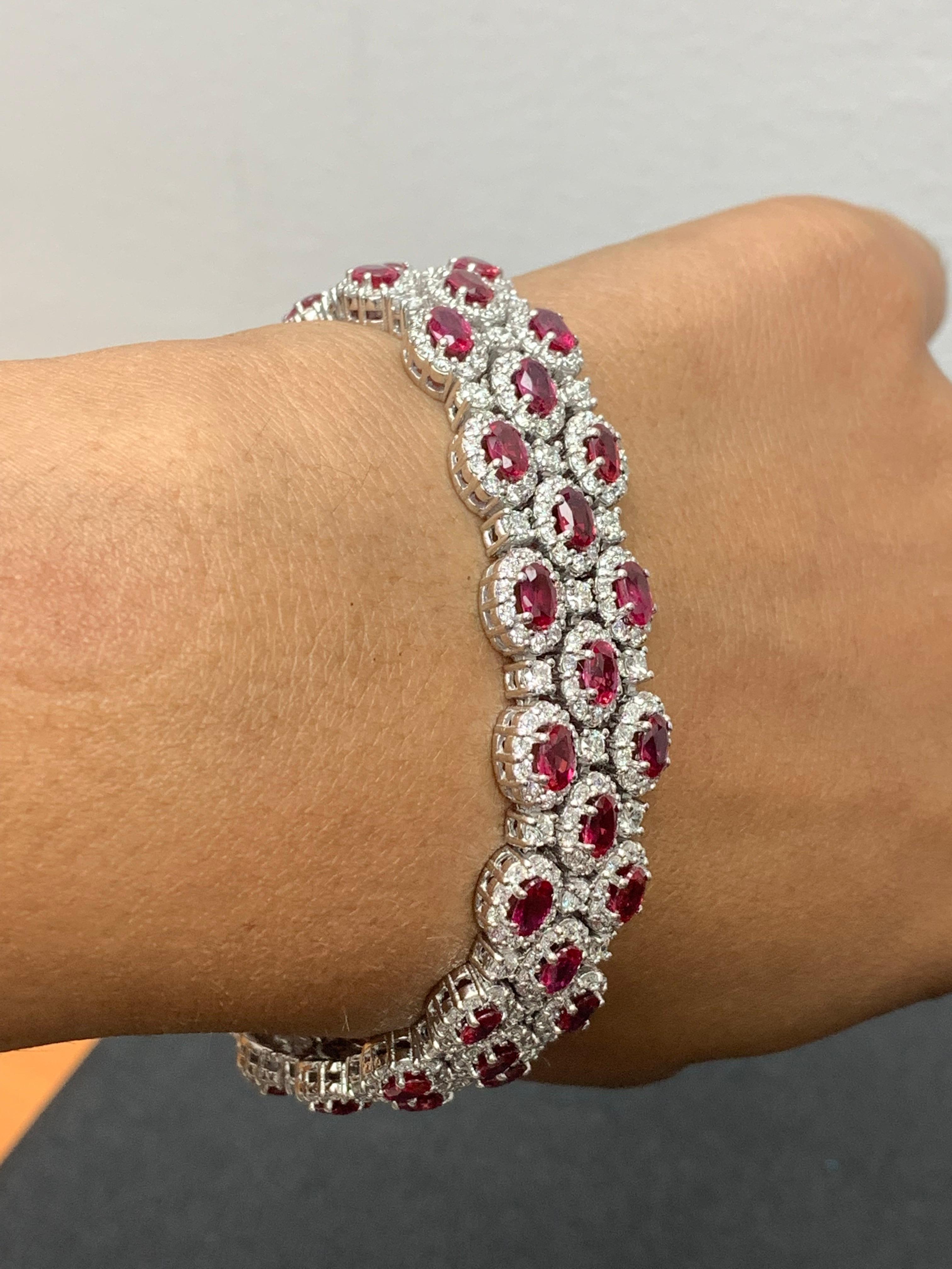 A beautiful vivid red Rubies and Diamond 3-row bracelet showcasing color-rich Rubies, surrounded by a single row of brilliant round diamonds. 51 Oval cut rubies weigh 14.91 carats total; 561 accent diamonds weigh 9.66 carats total. Made in 14k white