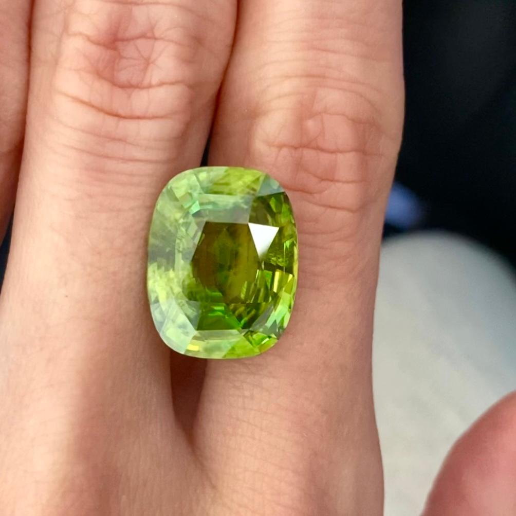 Sphene is a rare mineral that we don't often could find on the gem market. 
It could be different - green, yellow, brown, almost black. 
We were lucky to find for you a sphene with bright saturated neon apple green color and perfect saturation.
A