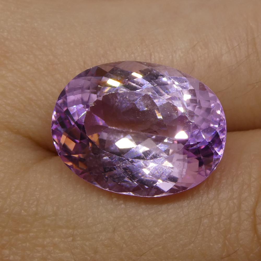 Description:

Gem Type: Kunzite
Number of Stones: 1
Weight: 14.92 cts
Measurements: 17.80x13.50x8.70mm
Shape: Oval
Cutting Style Crown: Modified Brilliant Cut
Cutting Style Pavilion: Mixed Cut
Transparency: Transparent
Clarity: Very Slightly