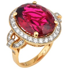 14.95 Carat Oval Shaped Rubelite Ring in 18 Karat Yellow Gold with Diamonds