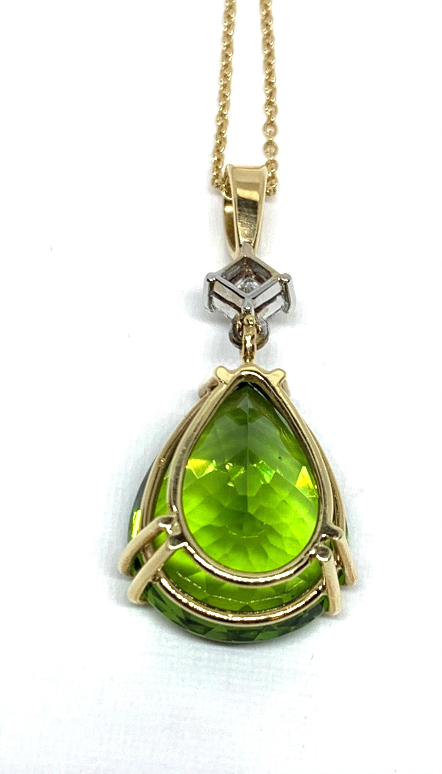 Bold and simply elegant are two adjectives that best describe this pretty pendant.  A velvety, key lime-green peridot is the perfect addition to any jewelry lover's collection, as the color compliments all colors of clothing. This impressive 14.96