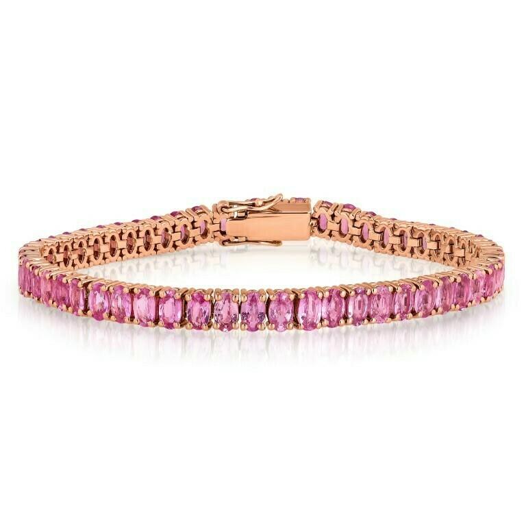 Shimmering oval-shaped pink sapphires total weight 14.99 carat set in rose gold.

