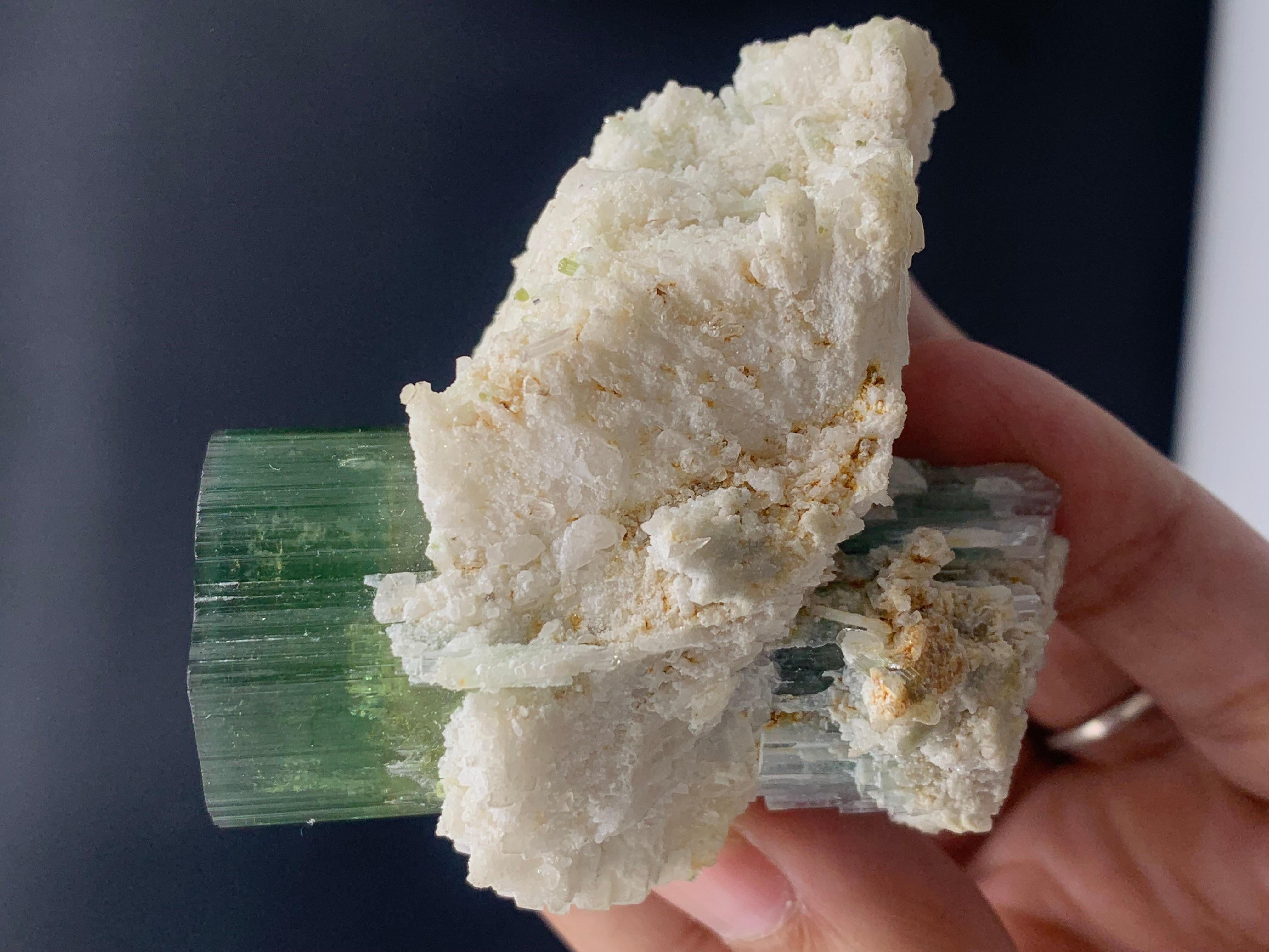 Magnificent Green Tourmaline Specimen From Afghanistan 
WEIGHT: 149.99 grams
DIMENSIONS: 6.4 x 6.7 x 4.5 Cm
ORIGIN: Afghanistan
TREATMENT : None

Tourmaline is an extremely popular gemstone; the name Tourmaline is derived from Turamali, which