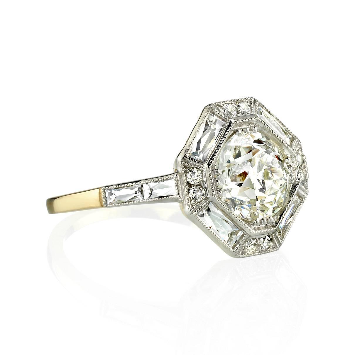 1.49ct L/VS2 GIA certified old Mine cut diamond set in a handcrafted 18K yellow gold and platinum mounting. The Art deco inspired design features an octagonal halo with French cut and old European cut diamond accents. The ring is currently a size 6.