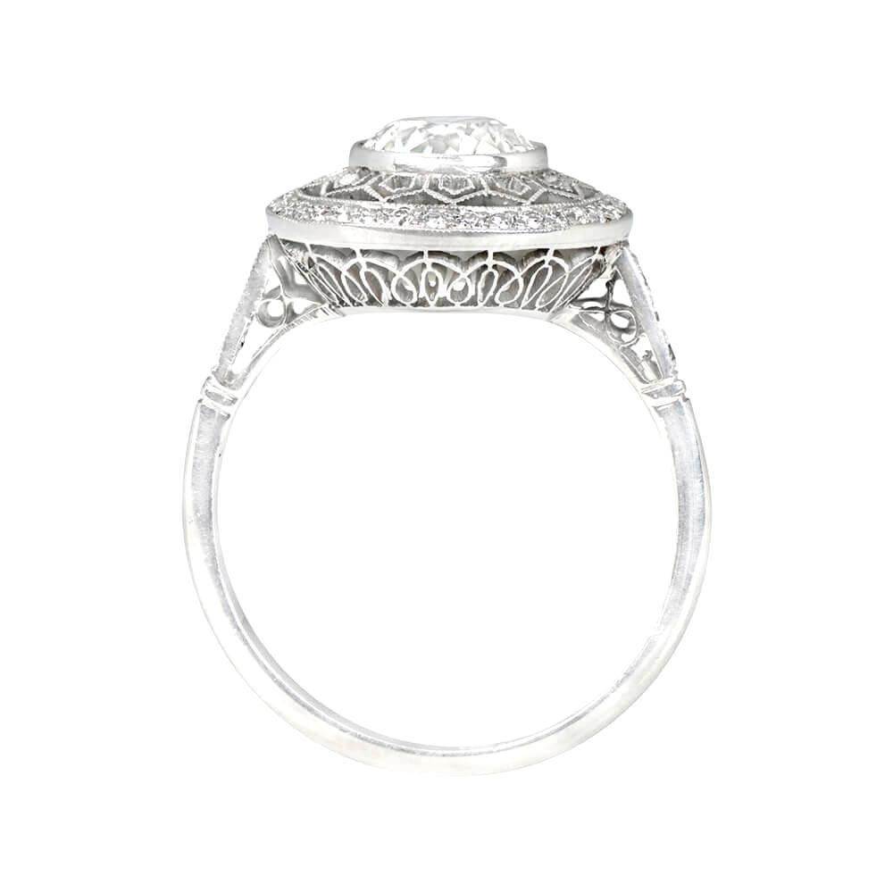 This Art Deco style ring is truly stunning, featuring a lively bezel-set old European cut diamond that weighs approximately 1.49 carats, with I color and VS2 clarity. The center diamond is surrounded by an intricate geometric lace openwork design