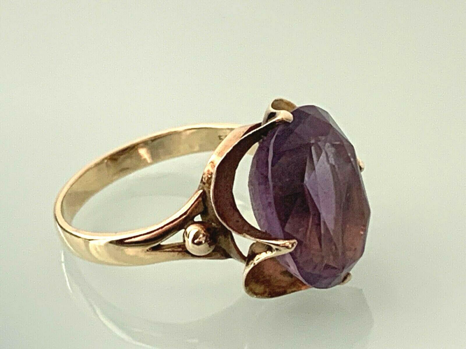 14ct 585 Gold  Purple Gem Stone Ring
Size of Stone 16mm x 12mm  
**unknown purple stone**
Era Late 20th Century 
Stamped 585 inside of Band

U.S Size 7 1/2
 
U.K Size P = 17.75 mm inner diametre