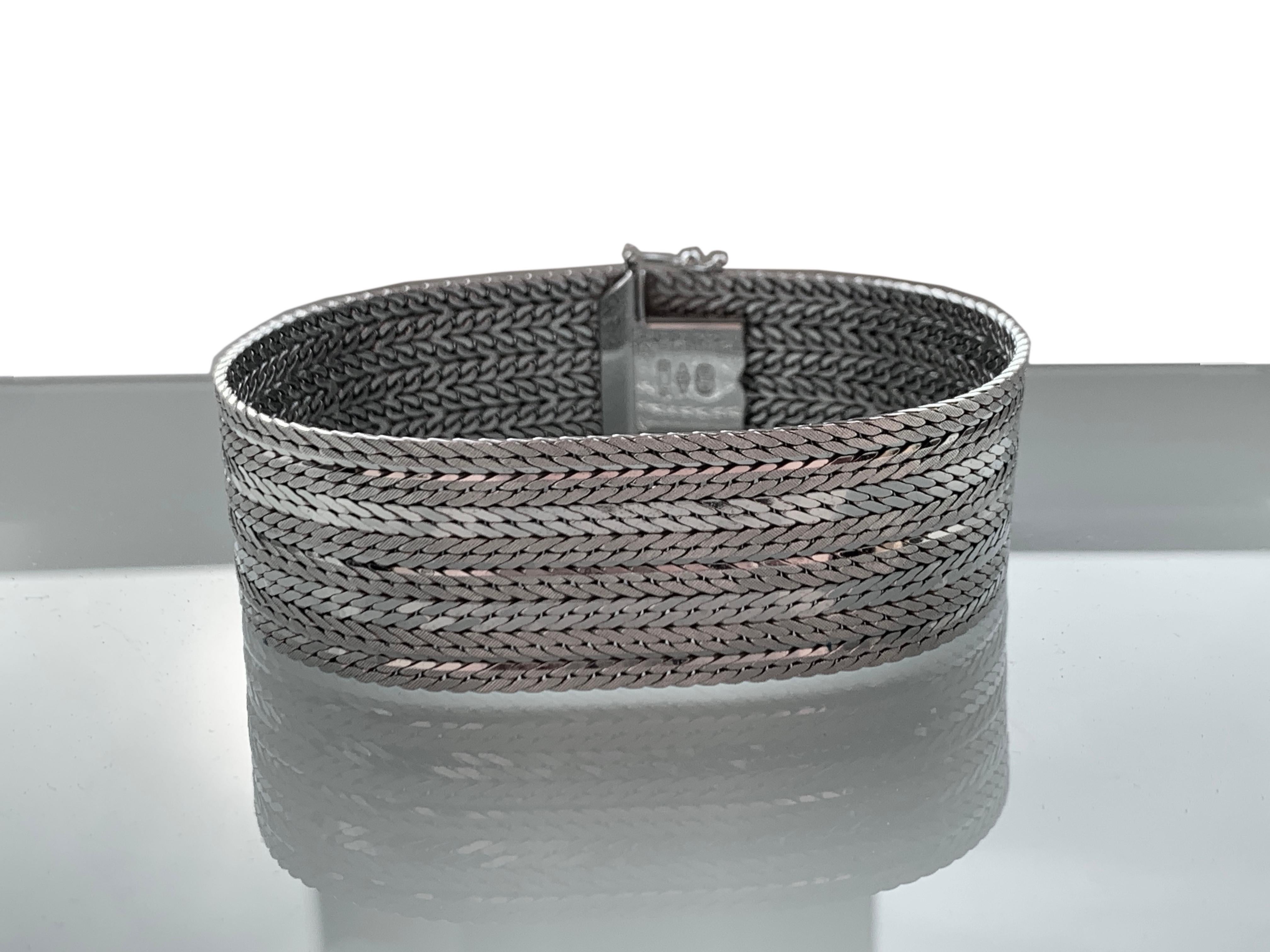 Beautiful Italian Heavy 14ct White Gold woven Bracelet
Collaboration between BREV & UnoAerre 
Slide in snap fastener with overarm to secure in place .
Fully Hallmarked 