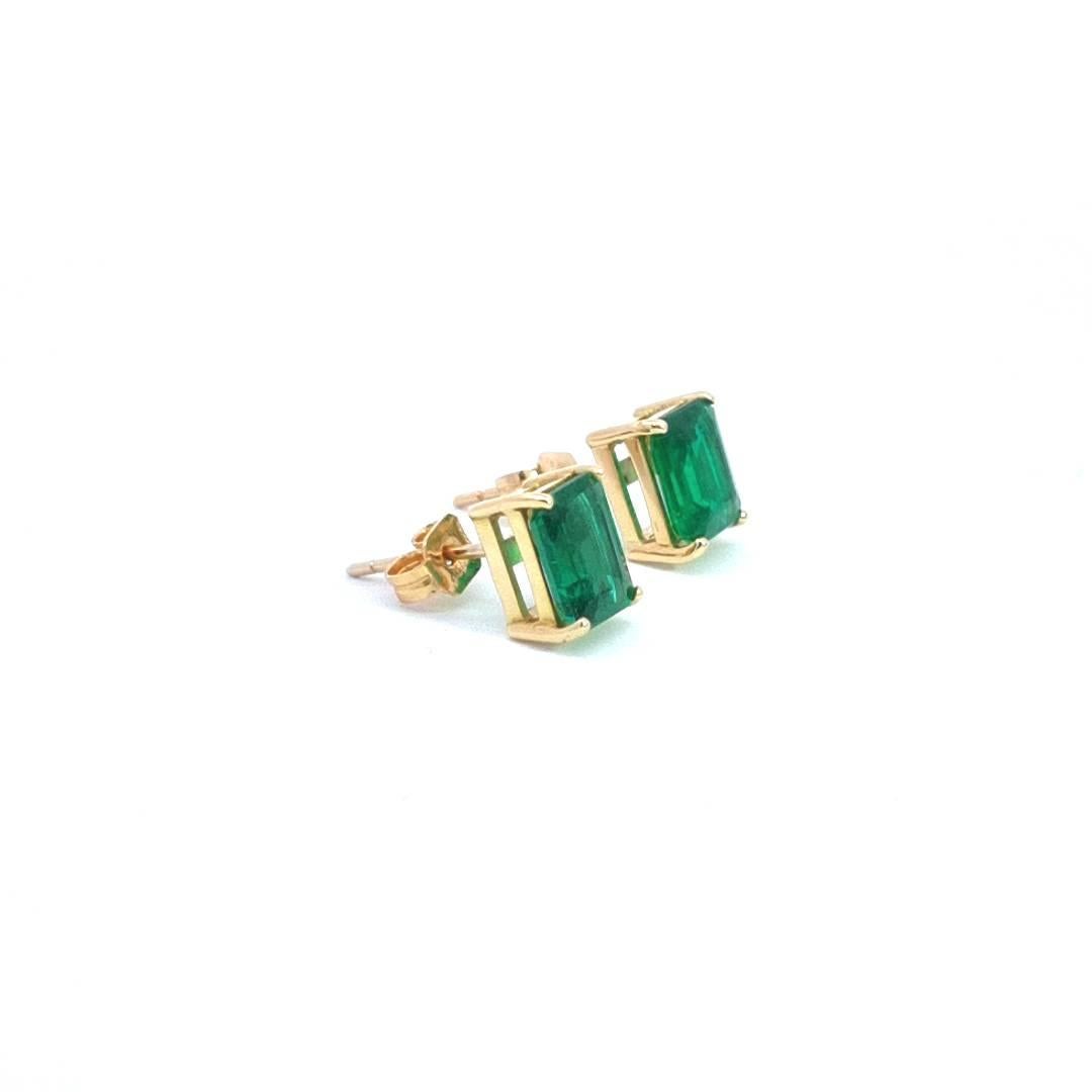 Emerald Cut 1.4ct Emerald Earrings in 18k Yellow Gold For Sale