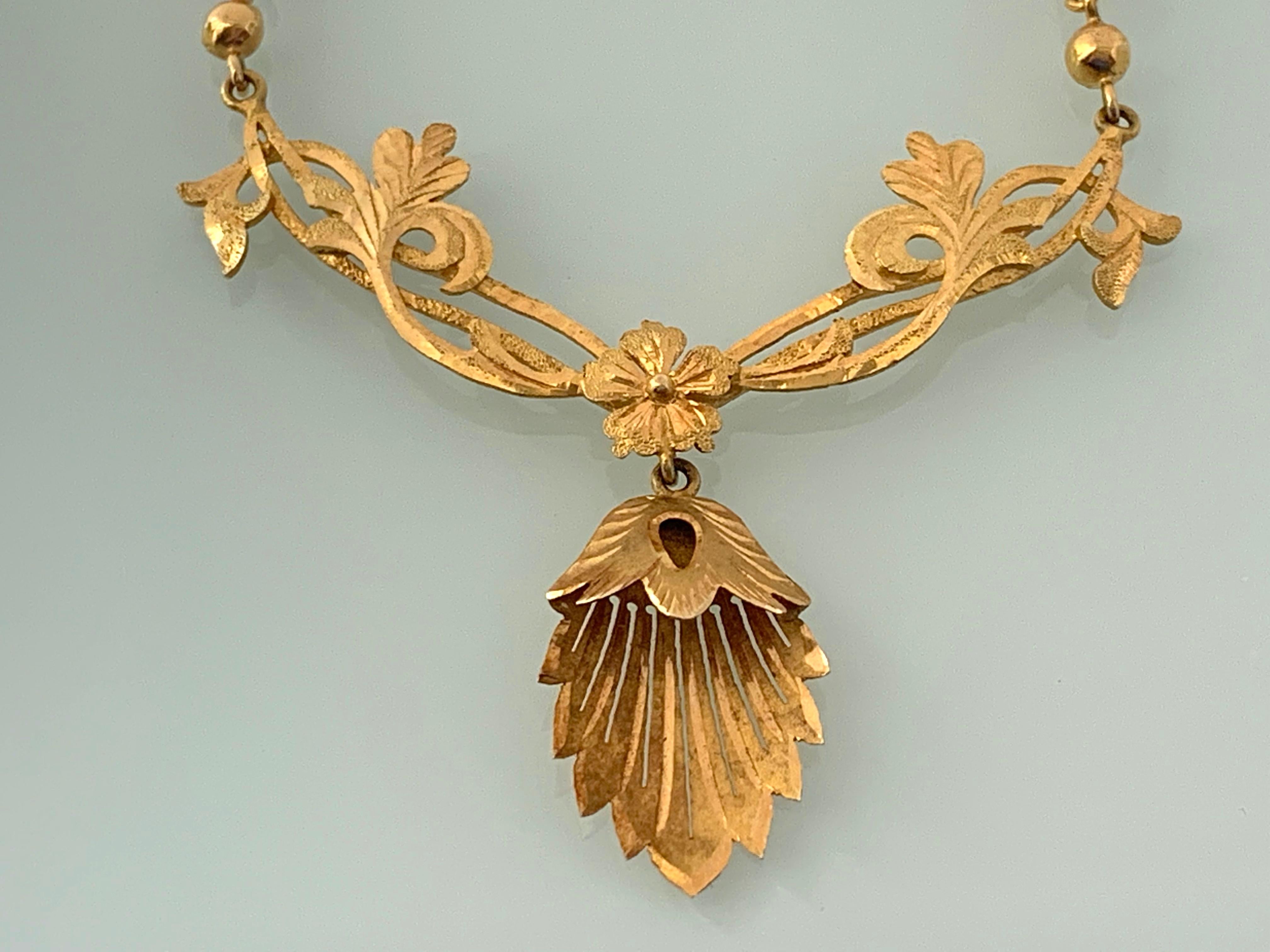 Antique 14ct 585 Gold hand made necklace 
Beautiful scrolling floral design with drop swing central flower head
Simplistic Chic timeless design
European Origin
Overall weight 8 grammes
Length 17.7 