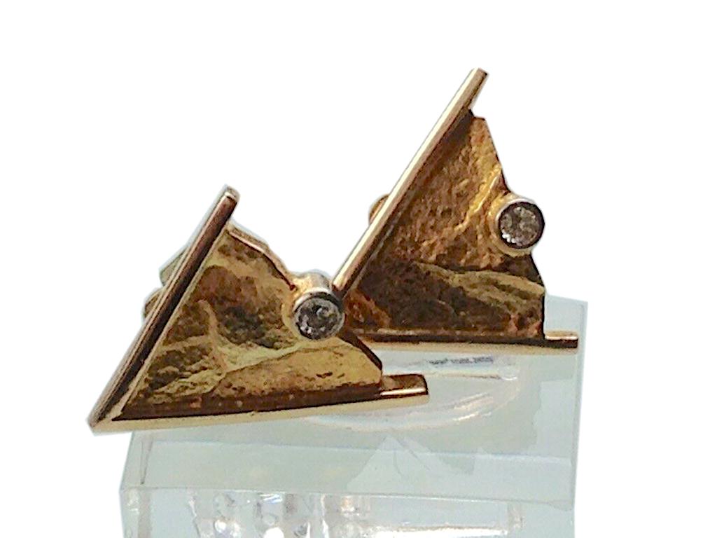 Vintage Contemporary 14ct Gold
Rock face surface triangular earrings
with two beautiful lively quality diamonds 
amounting to 0.12 Carats (0.06 carat each solitaire)
stamped 585 on reverse of each.
with their original backs
that fasten