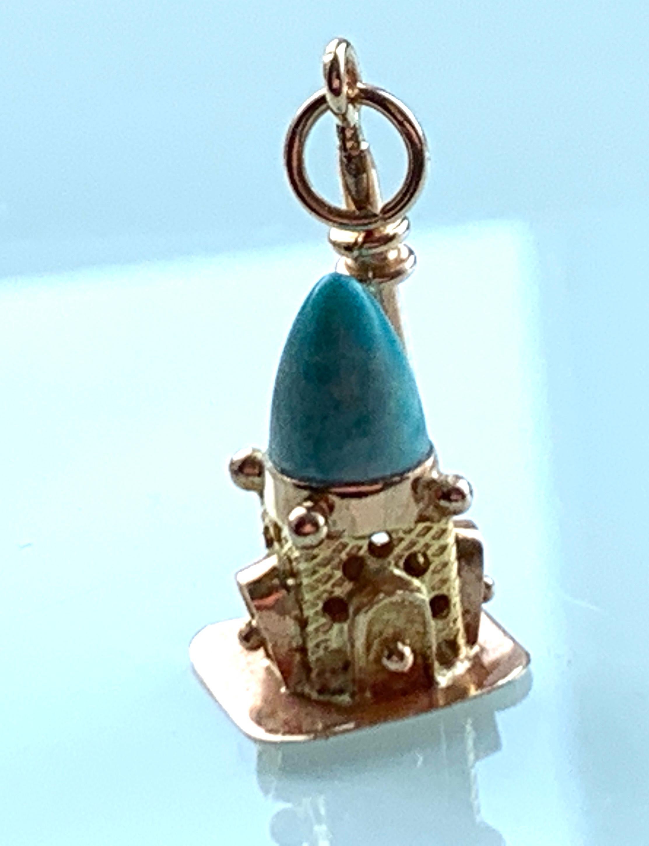 14ct 585 Gold Vintage CHARM
non precious turquoise stone completes the temple
Stamped on Base 585 with seriel numbers

