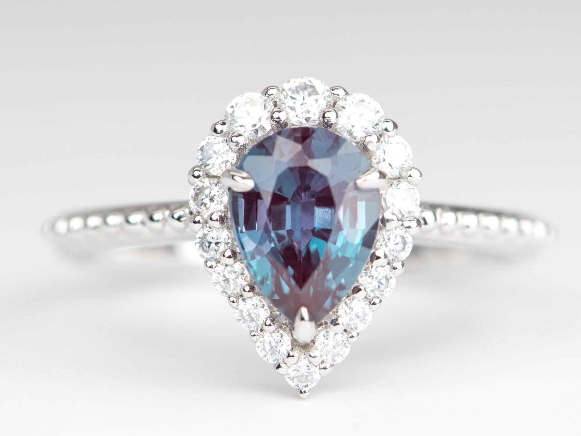 â™¥Â 1.4ct Lab-Created Alexandrite with Moissanite Halo Engagement Ring 14K White Gold
â™¥ Solid 14k white gold ring set with a beautiful pear-shaped lab-created alexandrite
â™¥ Gorgeous blue color!
â™¥ The item measures 12.7 mm in length, 9.3 mm in