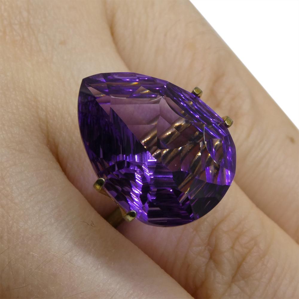 Description:

Gem Type: Amethyst
Number of Stones: 1
Weight: 14 cts
Measurements: 20.00 x 15.00 x 10.20 mm
Shape: Pear
Cutting Style Crown: Modified Brilliant
Cutting Style Pavilion: Mixed Cut
Transparency: Transparent
Clarity: Very Slightly