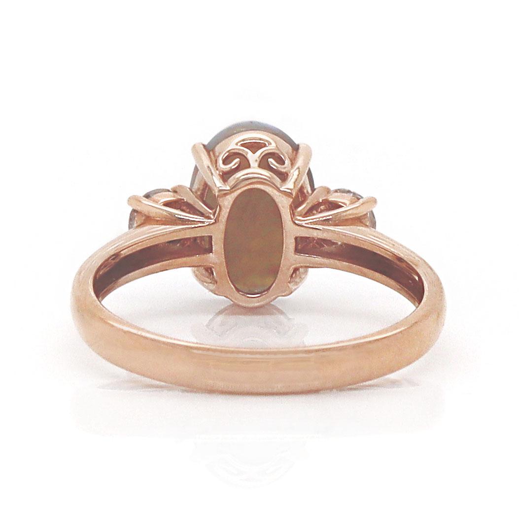 14CT Rose Gold Australian Opal And Diamond Trilogy Ring

Featuring an Australian Lightning Ridge opal and diamond trilogy ring. The opal showcases an enchanting palette of violet, orange, green, red, yellow, and blue, resembling a vibrant sunset