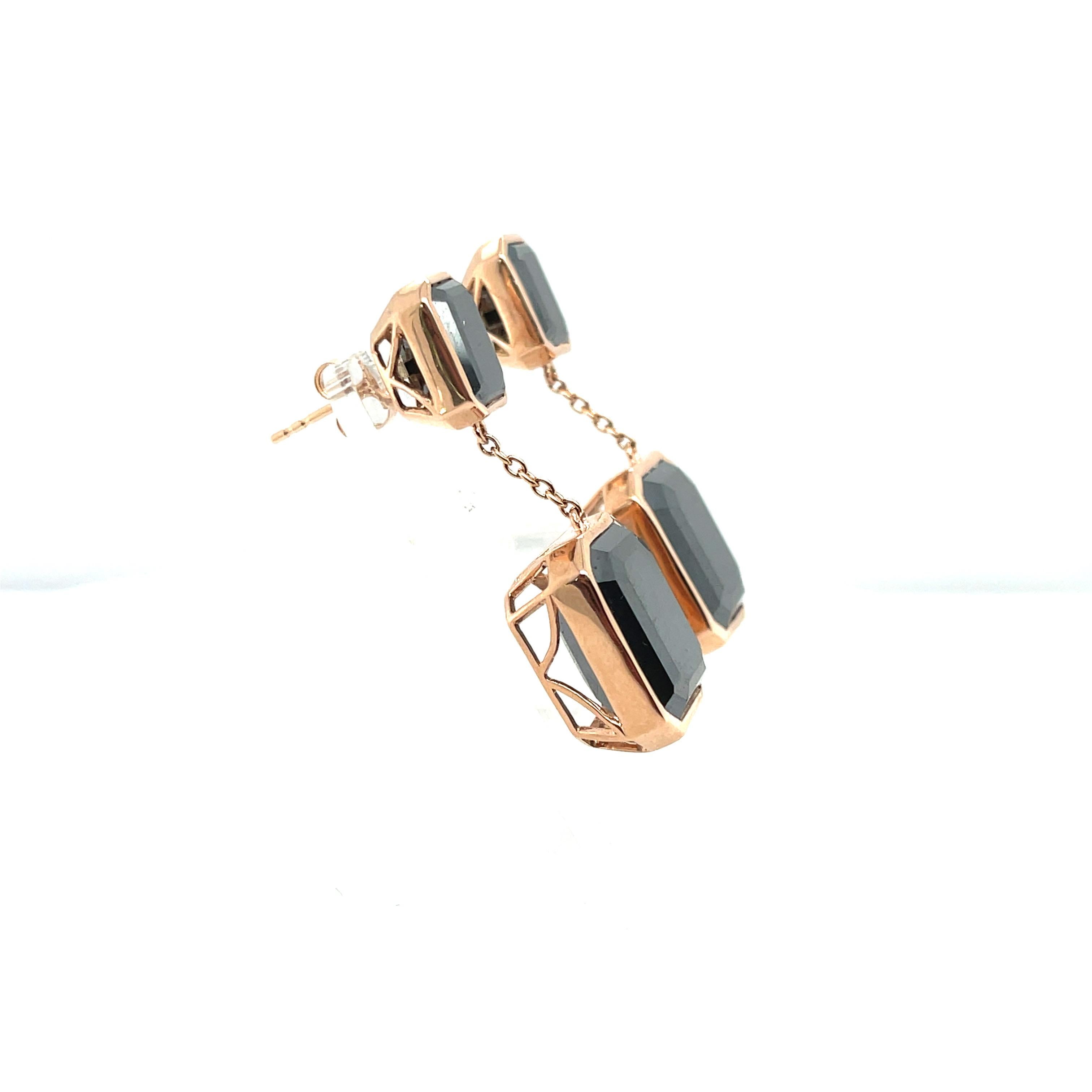 Lovely pair of black moissanites and diamond stud earrings, gorgeously crafted in fourteen karat rose gold, complimented by a stunning polished finish design.

 One pair of ladies - 14ct rose gold drop stud earrings, polished finish, with