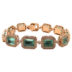 Bracelet en or rose 14 carats avec émeraudes de Colombie taille émeraude et diamants