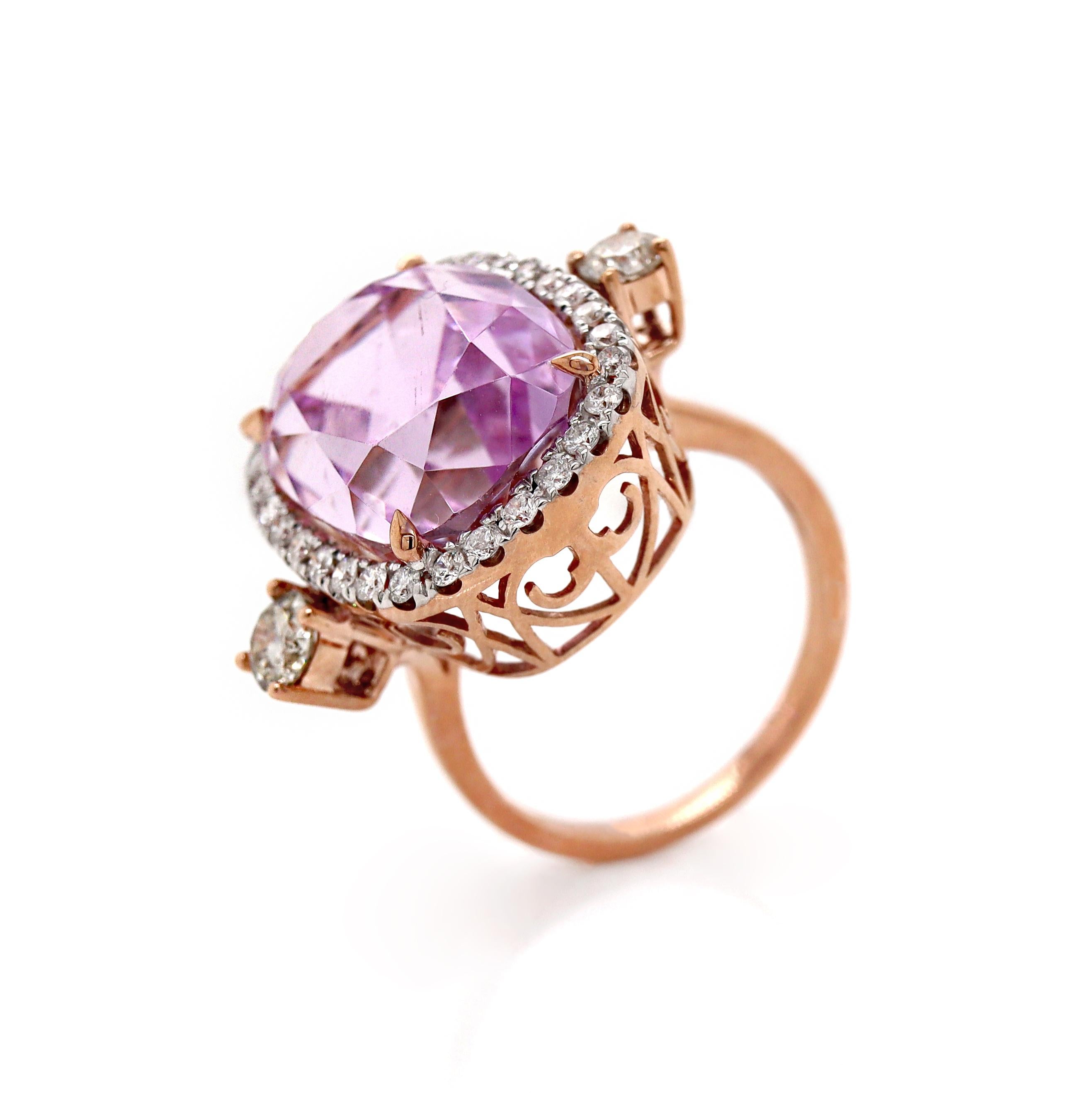 14CT Rose Gold Kunzite And Diamond Cocktail Ring

This cocktail ring both understated grace and bold luxury, centered with a stunning cushion cut Kunzite. The Kunzite, with its soft lavender pink hue, exudes a delicate, ethereal charm. Lifted by two