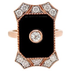 Anillo de cóctel de ónix y diamantes en oro rosa de 14 quilates