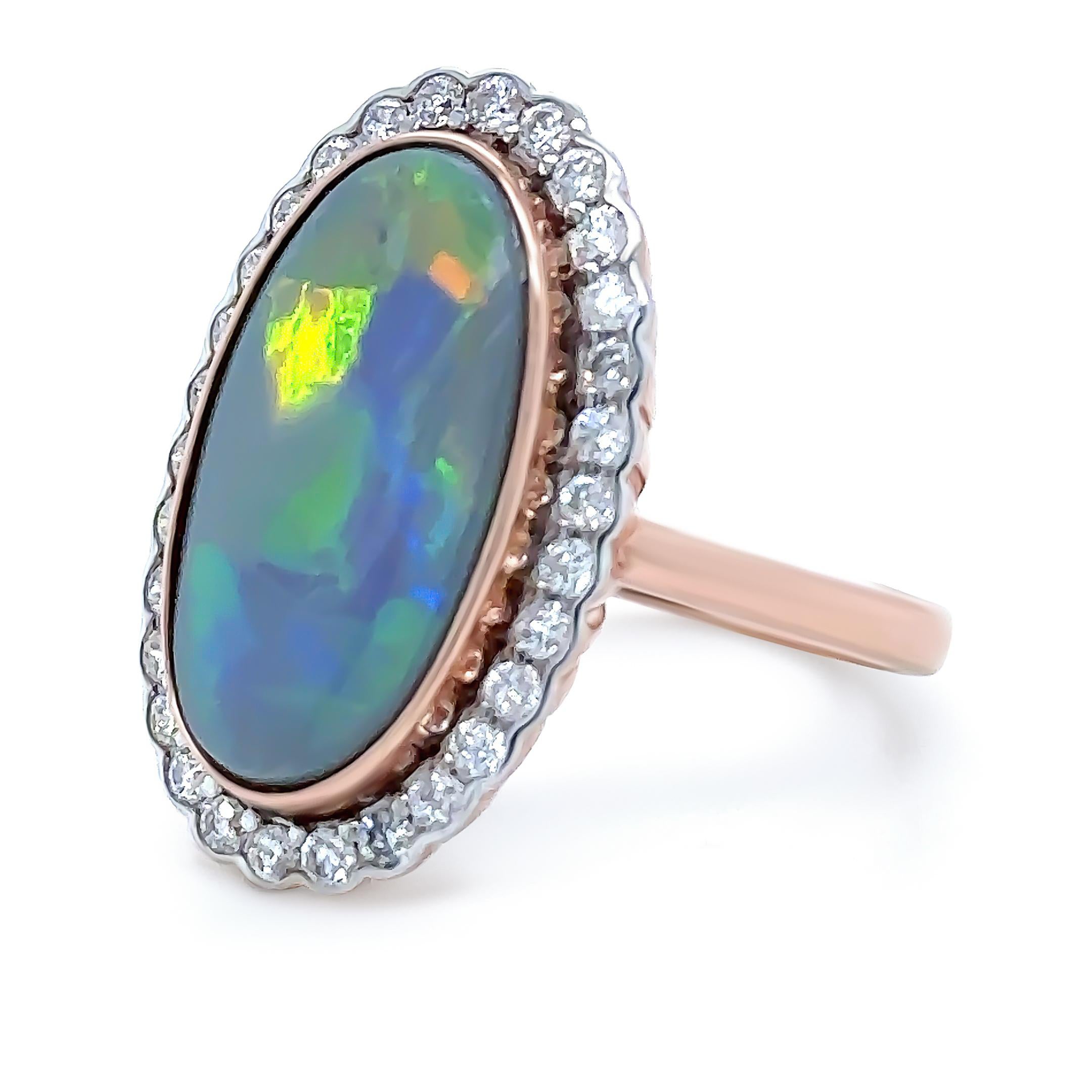 A Opal and Diamond Dress Ring, made of 14ct Rose Gold and Rhodium Plating. Featuring 1 Lightning Ridge Oval Cabochon Cut Opal, Bezel set, weighing 4.40ct.

Also accompanied by a total of 30 Round Brilliant Cut Diamonds, each individually set in a