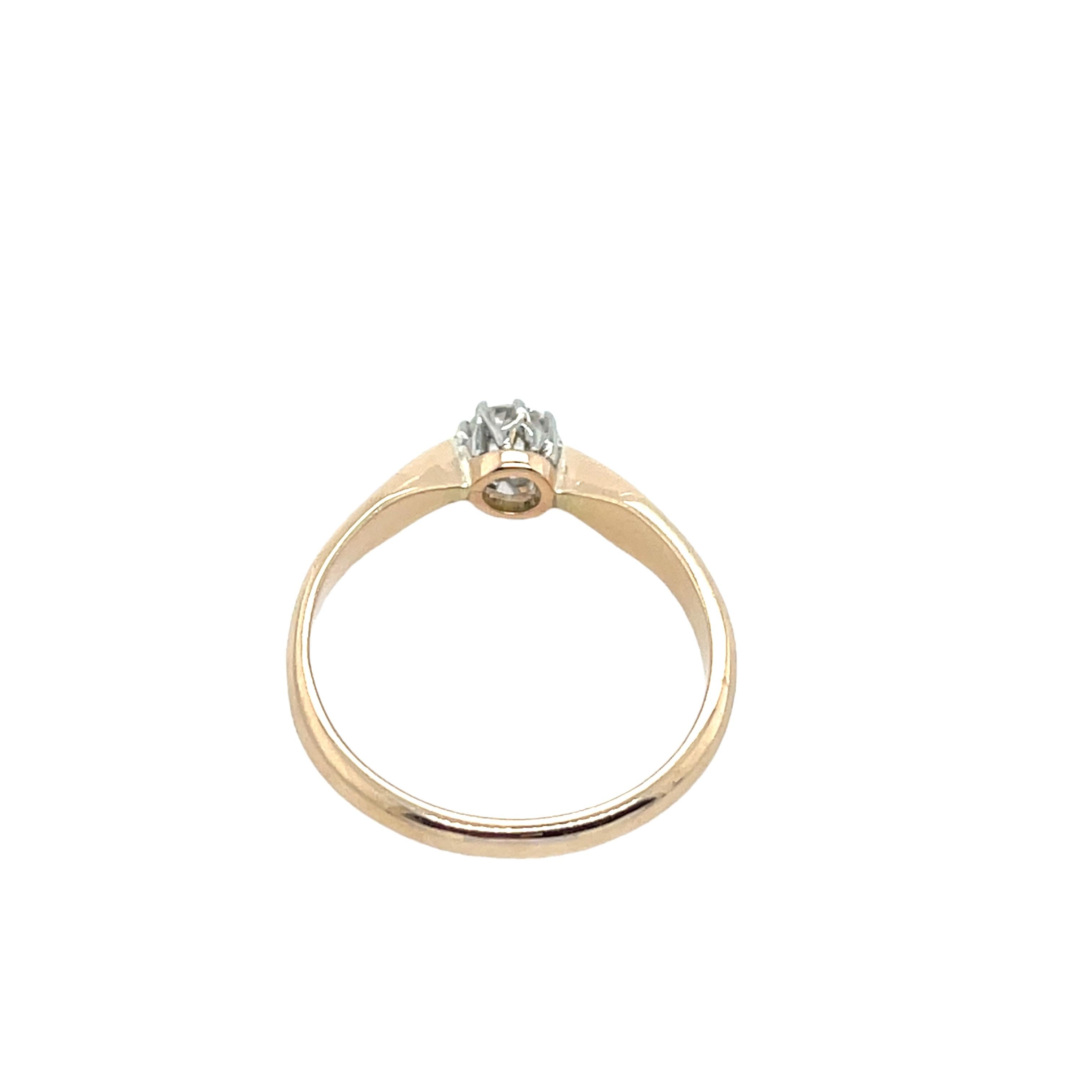 A classic diamond ring featuring a 0.25ct round brilliant old cut diamond, beautifully set in a blend of 14ct rose gold and platinum. The design combines the warmth of gold with the elegance of platinum.

Total Diamond Weight: 0.25ct
Diamond Colour: