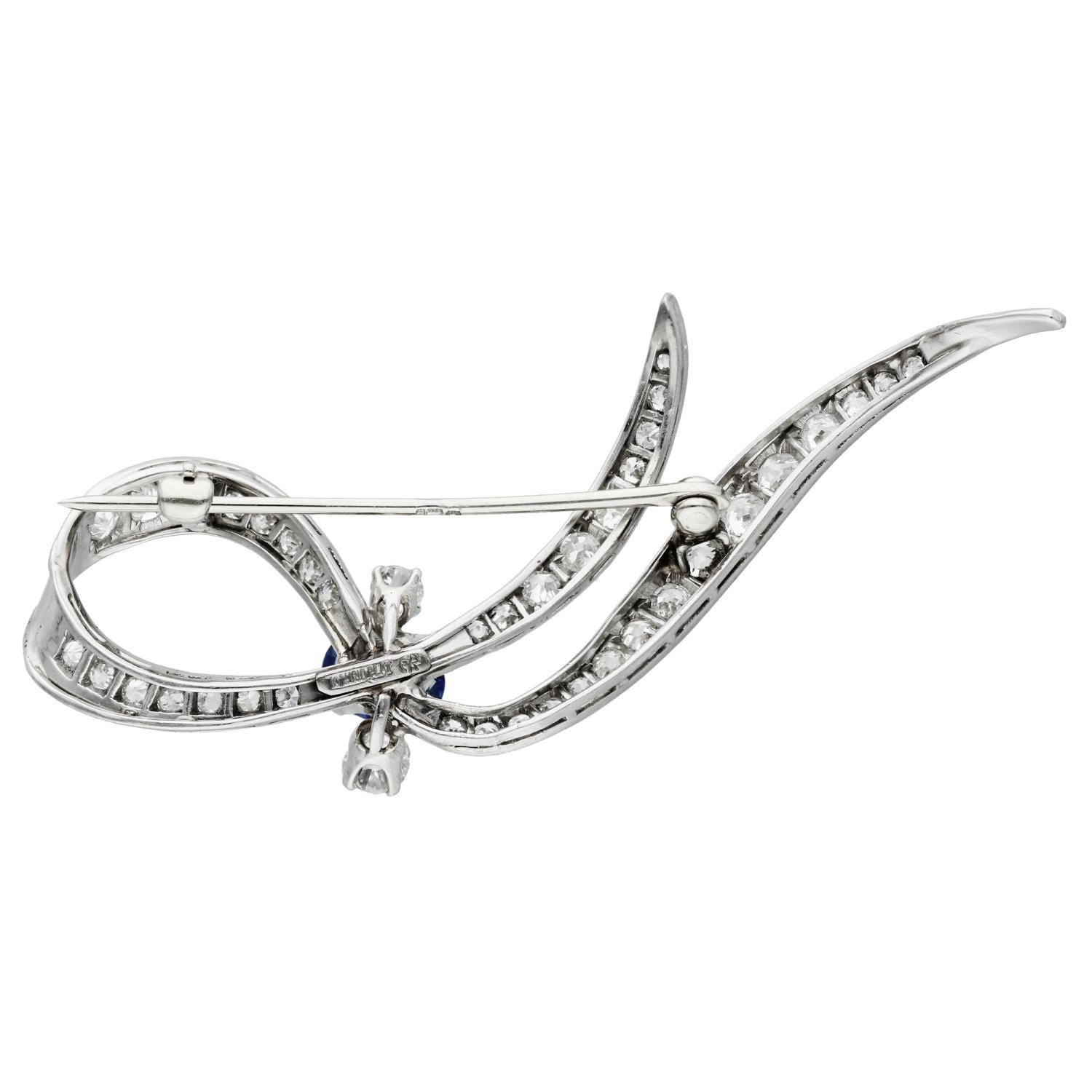 14ct White Gold 0.60ct Sapphire & 1.45ct Diamond Brooch

Elevate your elegance with our Pre-Loved 14ct White Gold Sapphire & Diamond Brooch, a timeless piece of sophistication and style. This exquisite brooch boasts a ribbon design, featuring