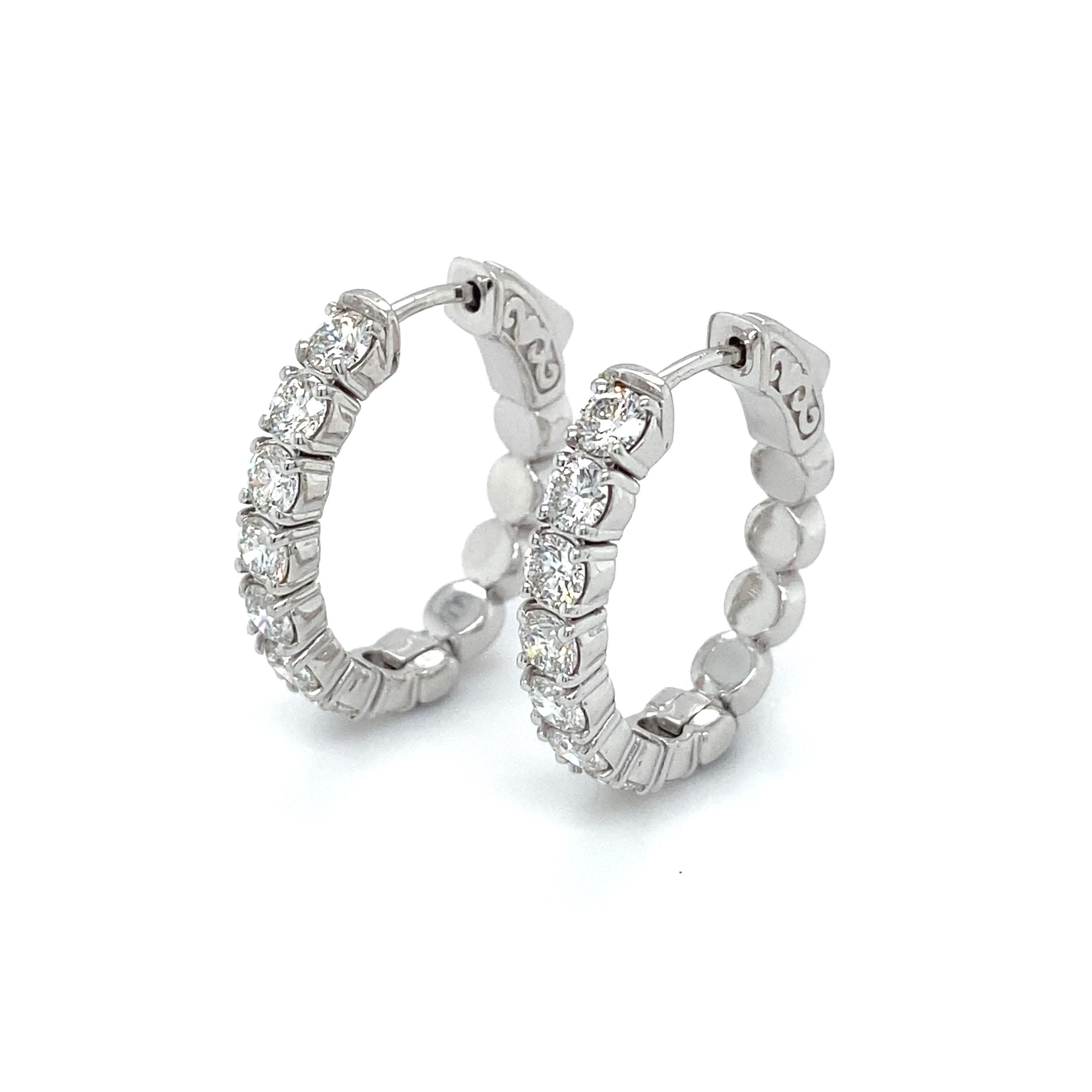 These 14ct white gold oval hoop earrings are a wardrobe staple.

They are set with a total of sixteen (16) diamonds weighing 2.20cts, these are F/G in colour and VS-SI in clarity. 

The mount is beautifully finished and has a sophisticated press