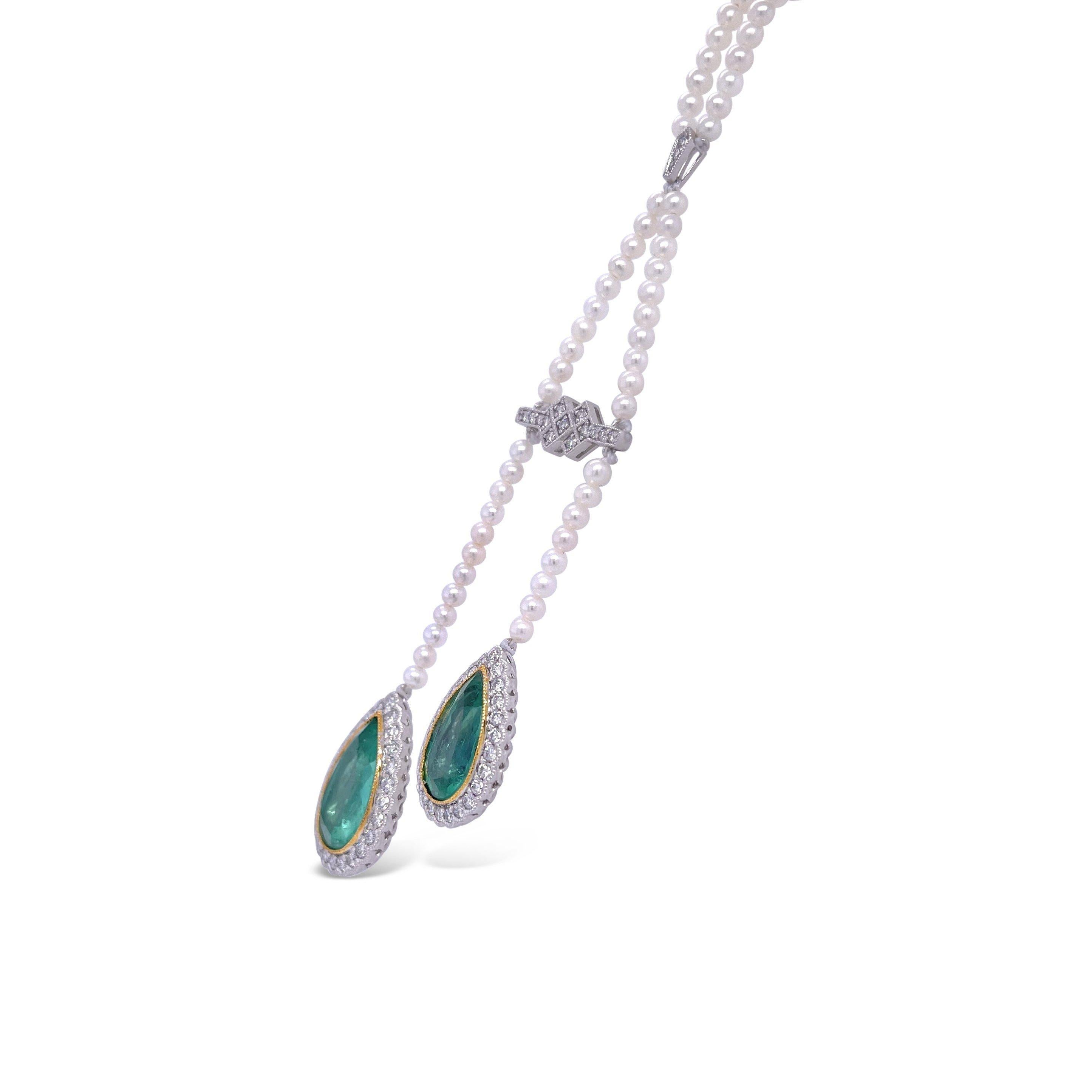 Platinum pear cut double drop emerald pendant, single strand necklet semi round cultured medium cream pearls featuring a beautiful selection of sixty-six claw and rub over set round brilliant cut diamonds, complimented by a polished finished design