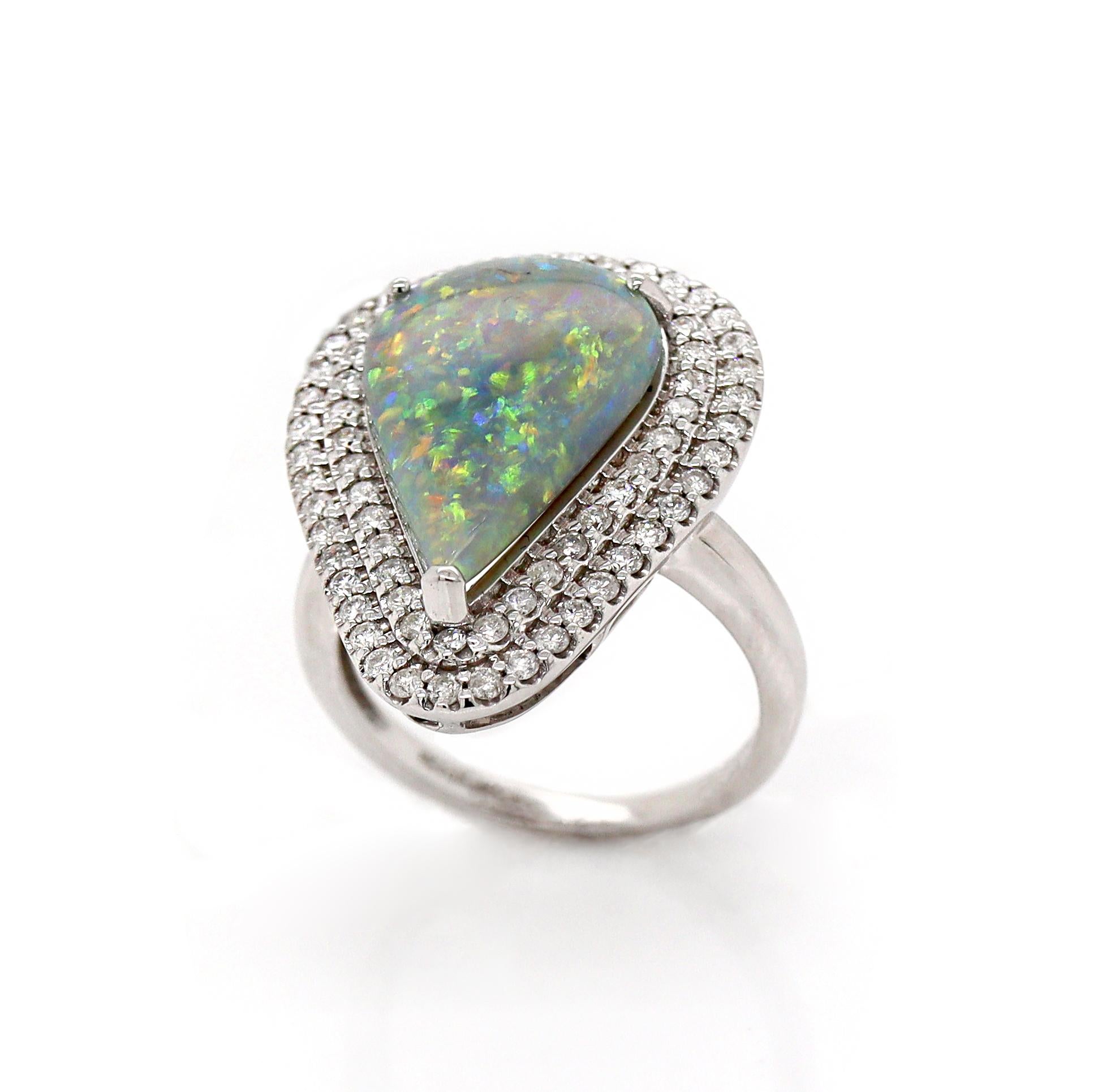 14CT White Gold Australian Opal And Diamond Cocktail Ring

This stunning cocktail ring features a pear cabochon-cut Australian Opal from Mintabie, renowned for its vivid play of color. The Opal's unique surface displays a mesmerizing dance of