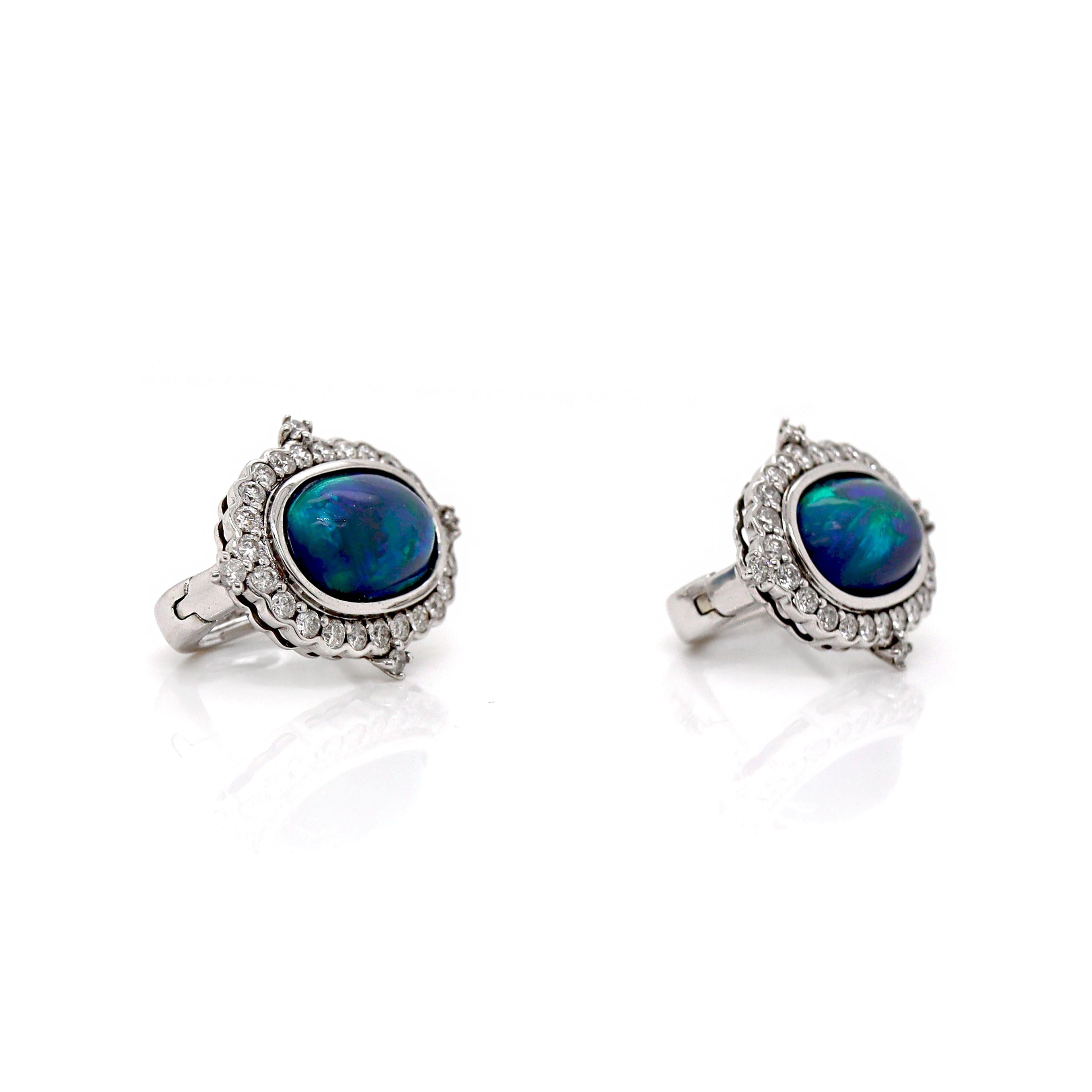 14CT White Gold Australian Opal And Diamond Earrings

Featuring 2 stunning oval cabochon-cut Australian Opals sourced from Lightning Ridge in display of mesmerizing blue and green hue solid flashes. Accompanied by 44 round brilliant cut diamonds set