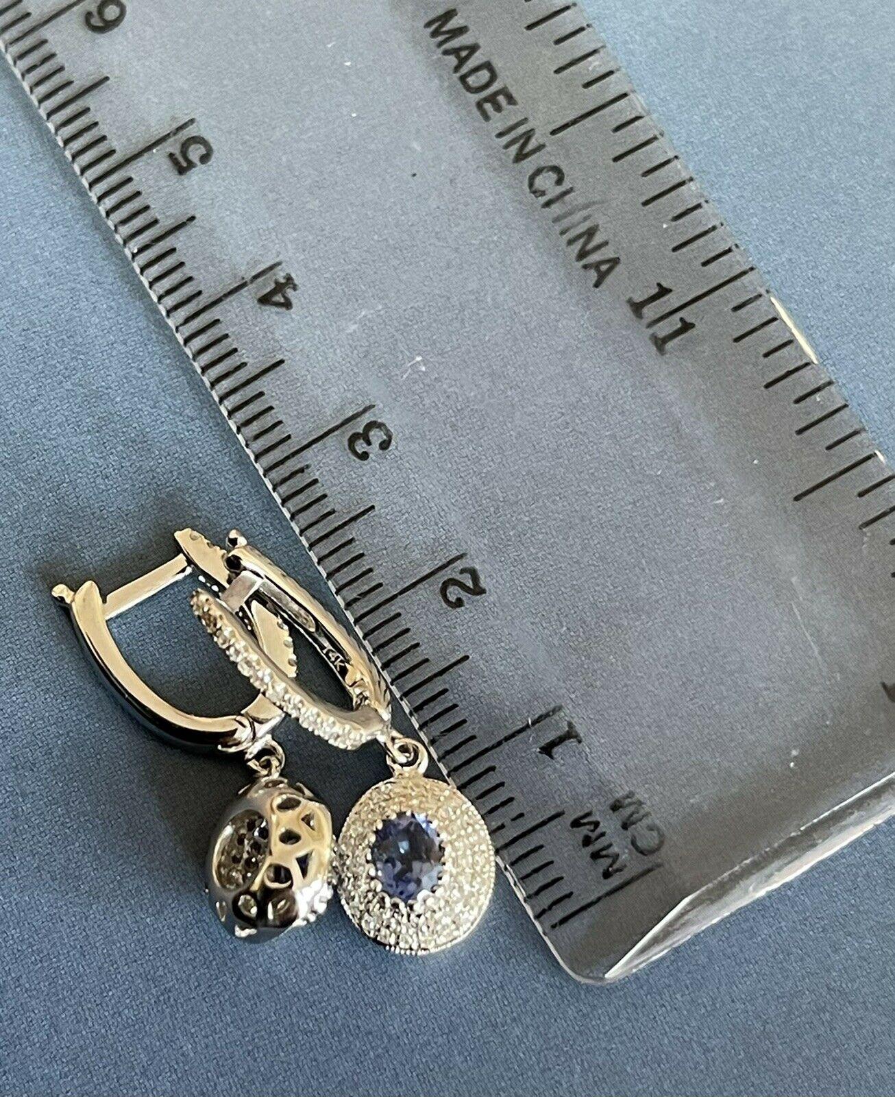 Boucles d'oreilles pendantes en or blanc 14 carats avec saphir et halo ovale de 1 carat en vente 4