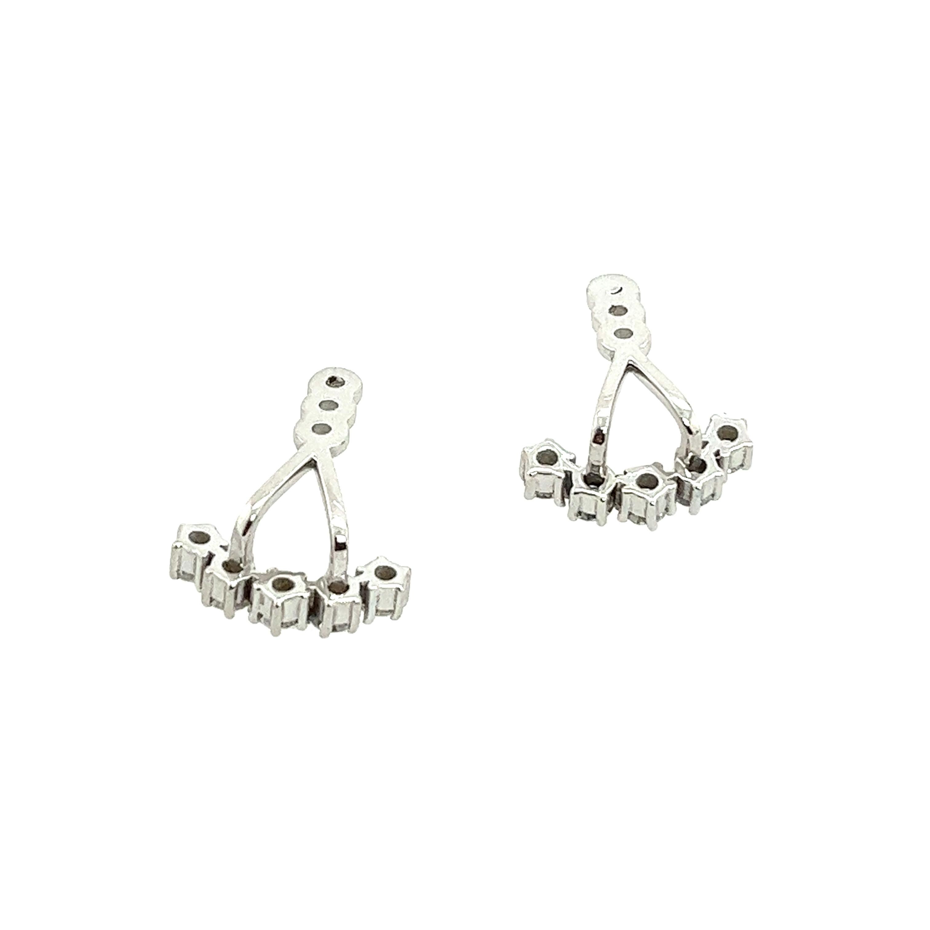 This earring jackets fit behind any stud earring, are set with 5 round brilliant cut diamonds in each earring, with total diamond weight 0.40ct. Set in 14ct white gold. The earrings are stylish and perfect for everyday wear.
Total Diamond Weight: