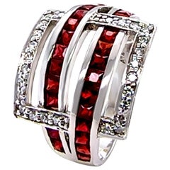 Anello in oro bianco 14ct con granato e diamanti 0,26ct 6,35g