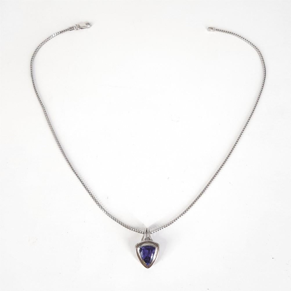 This stunningly designed necklace is 41cm in length weighs 11.7grams. The chain is set in 14carat White Gold featuring a 18ct white gold pendant studded with 1 Triangular Cut Tanzanite weighing a total of 4.40carat