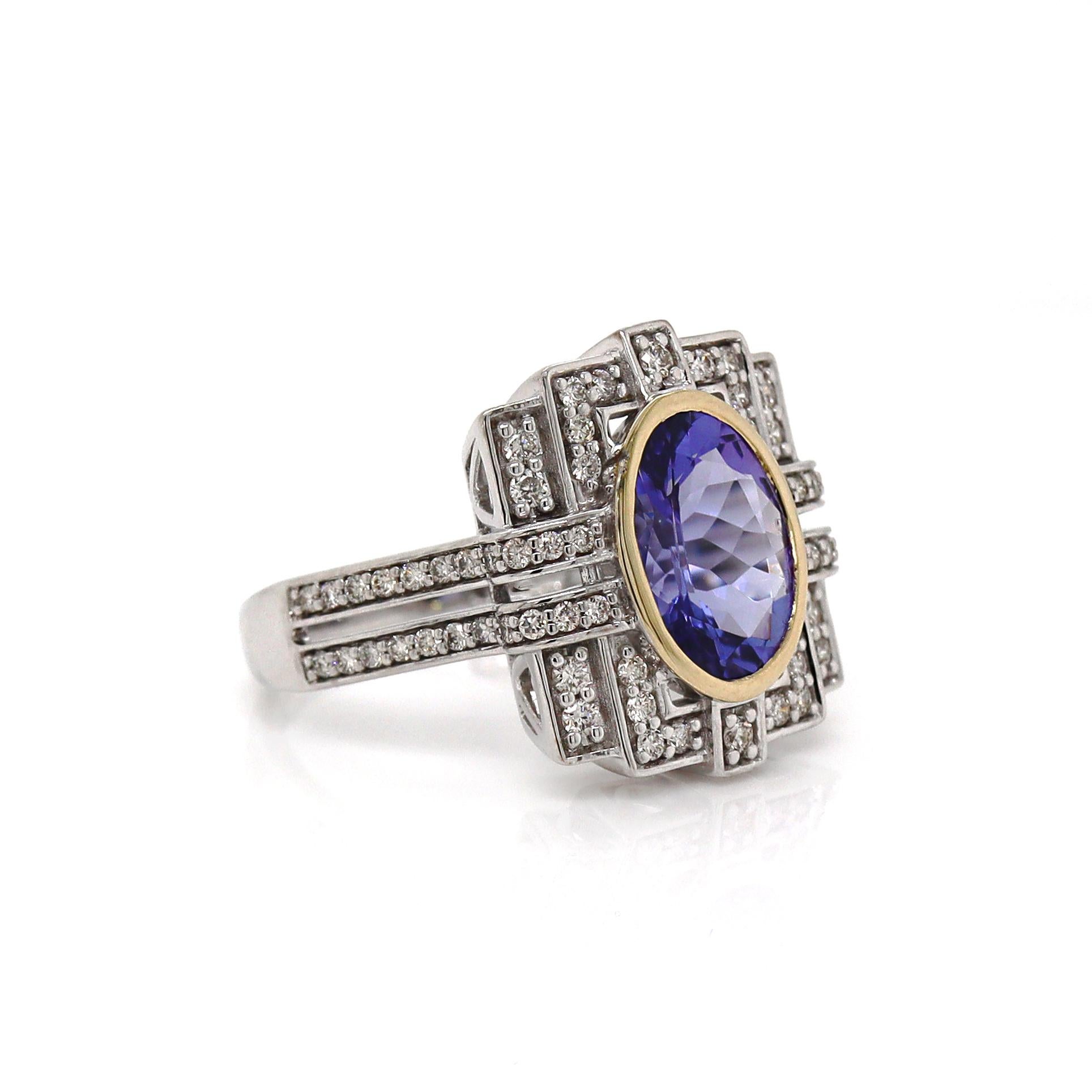 14CT White Gold Tanzanite And Diamond Cocktail Ring

This stunning 14ct white gold ring features a captivating oval-cut tanzanite at its center, exuding a rich blue-violet hue that draws the eye. The tanzanite is elegantly framed by a dazzling