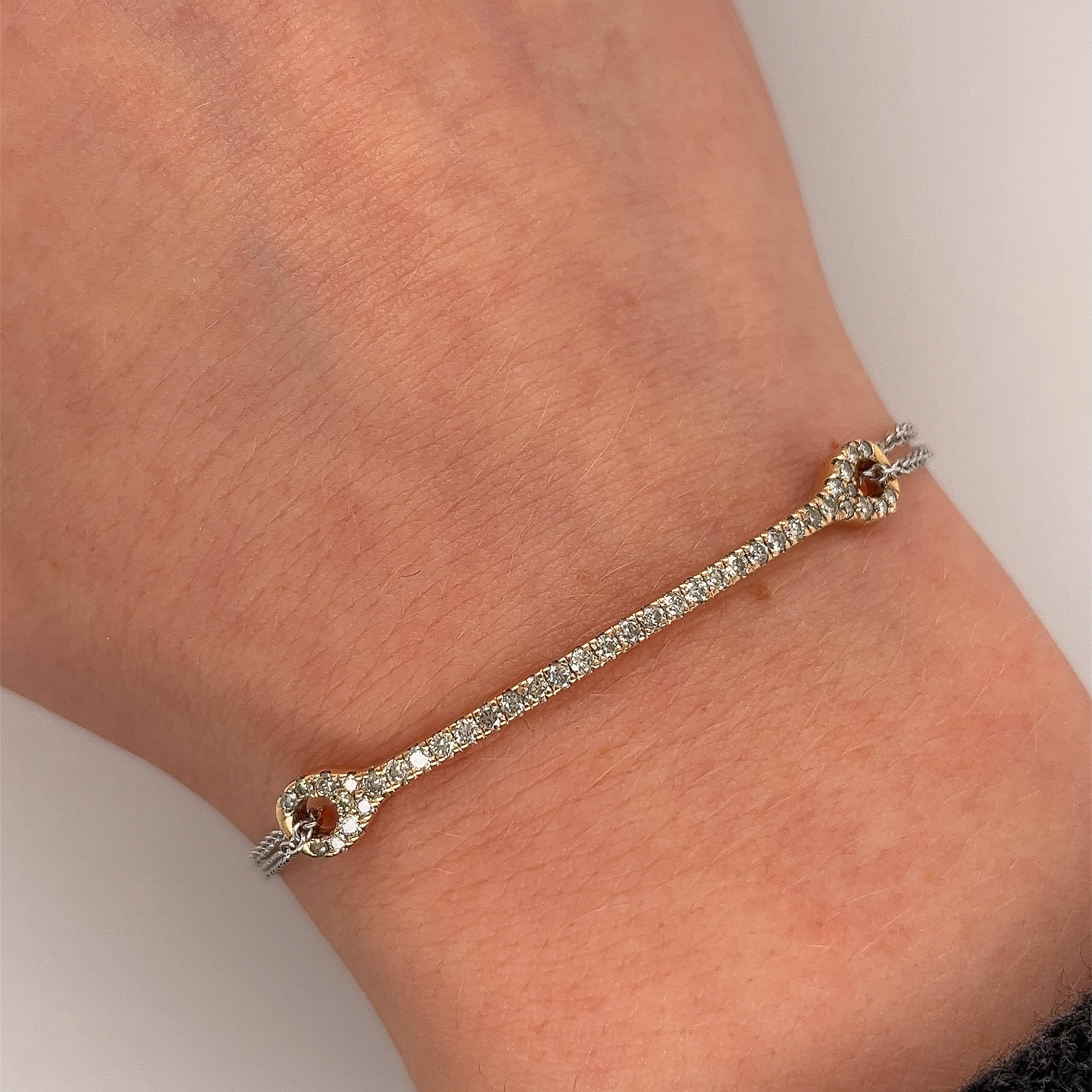 This bracelet is made of 14ct yellow gold with white gold chain 
and set with 0.54ct natural yellow diamonds, 
and has a beautiful finish. 
This design is ideal for everyday wear.

Total Diamond Weight: 0.54ct
Diamond Colour: yellow
Diamond Clarity: