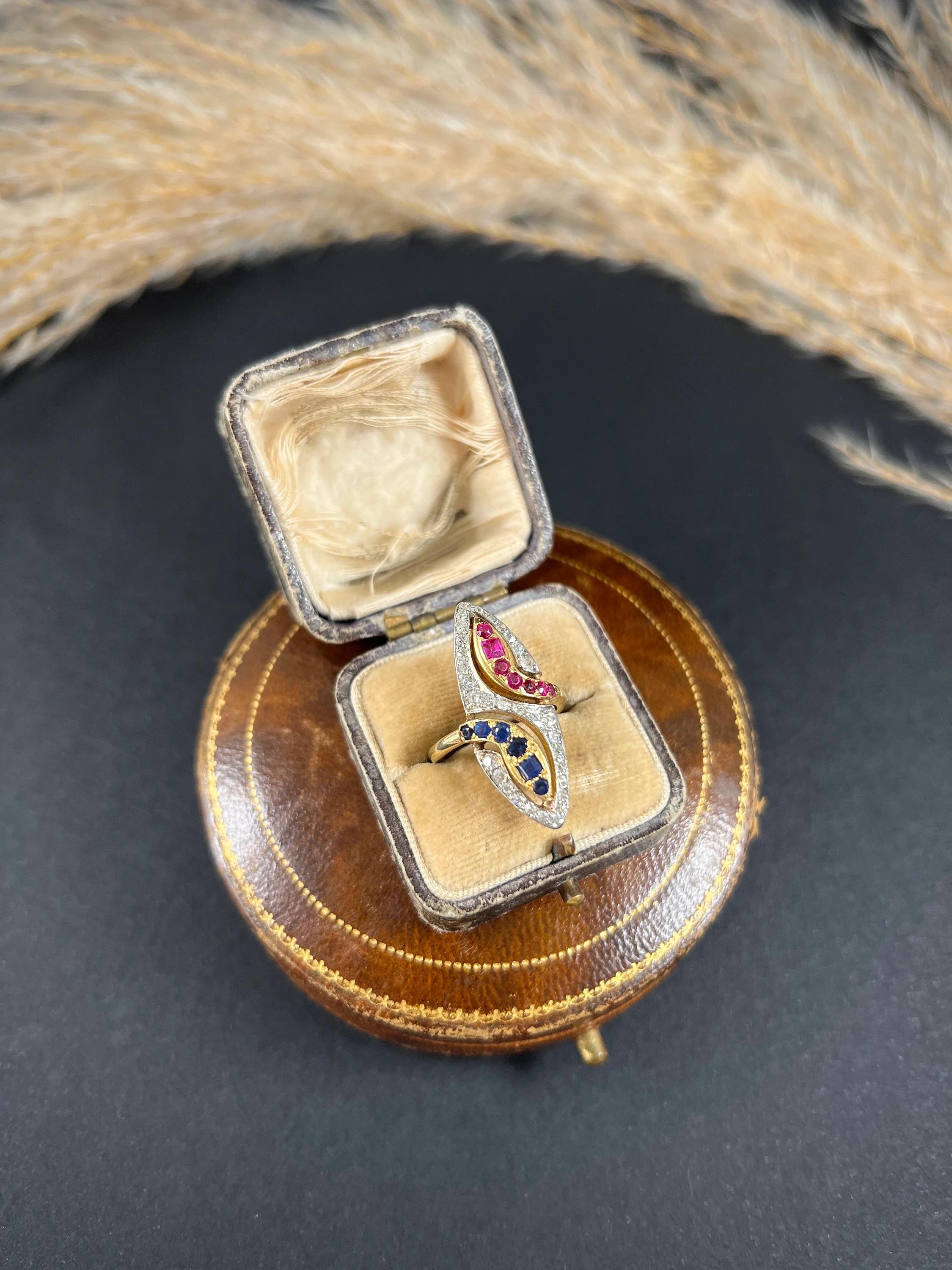 Vintage Snake Ring 

14ct Gold Tested

Circa 1950s

This stunning vintage snake ring from the 1950s is a true gem. Crafted from 14ct yellow gold, the ring features a unique two-headed design, with one head adorned with beautiful rubies and the other