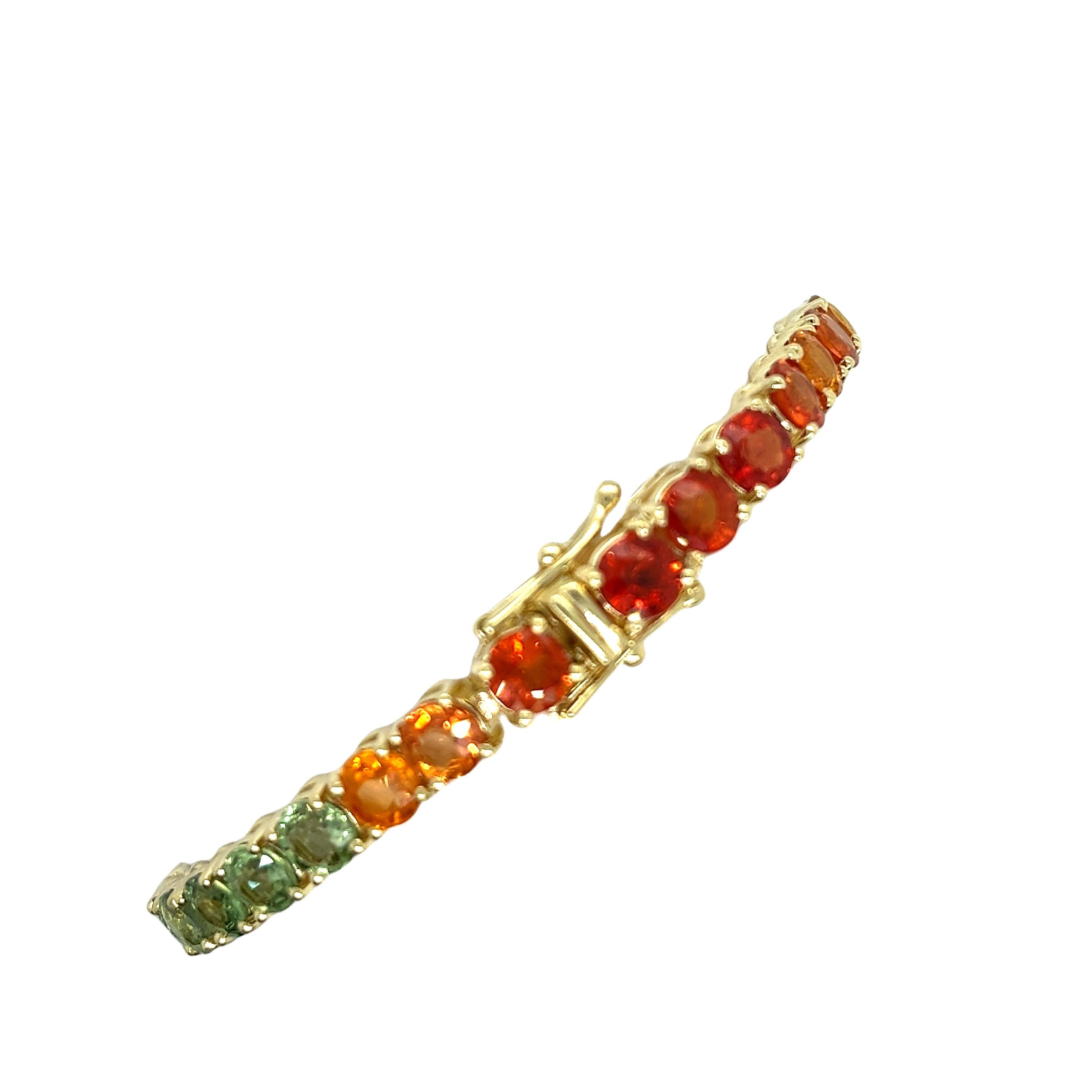 Embrace vibrant luxury with this stunning 14ct Yellow Gold Rainbow Bracelet, featuring 23ct of natural sapphires in a dazzling array of colours. This exquisite piece is perfect for adding a splash of colour and elegance to any outfit, making it a