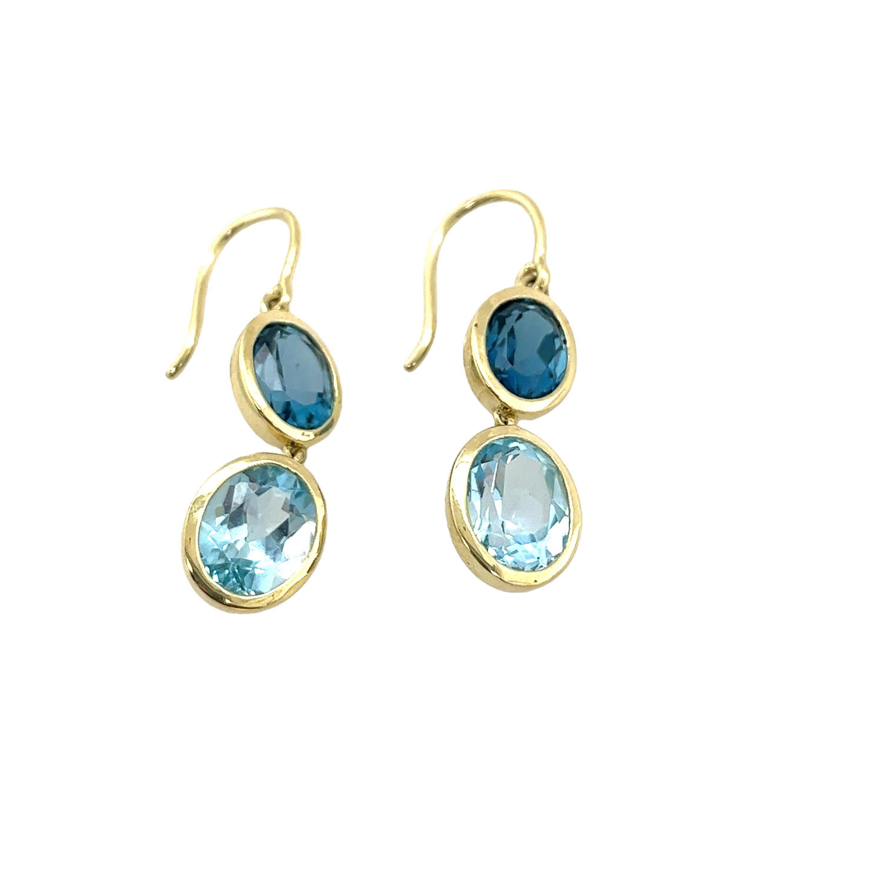Enhance your jewellery collection with these stunning 14ct yellow gold drop earrings, 
featuring both blue topaz and London Blue Topaz gemstones. 
These exquisite earrings showcase a harmonious blend of vibrant blue hues, 
creating a sophisticated