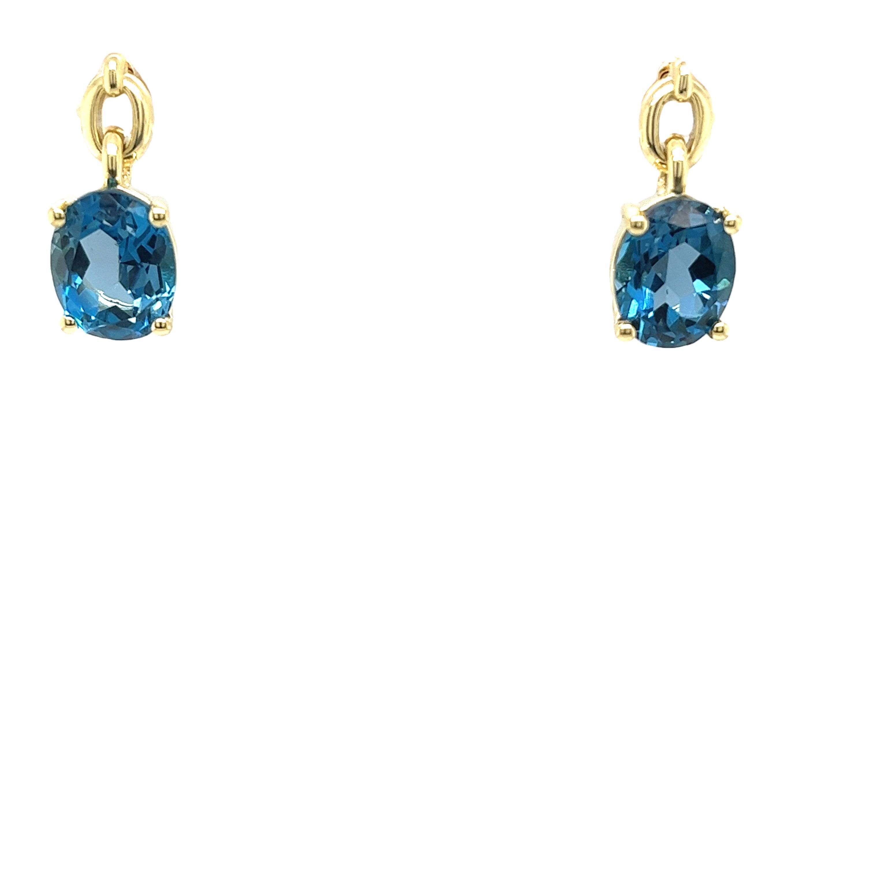 Enhance your jewellery collection with these stunning 14ct yellow gold drop earrings, featuring both blue topaz gemstones. 
These exquisite earrings showcase a harmonious blend of vibrant dark blue hues, creating a sophisticated and luxurious look.