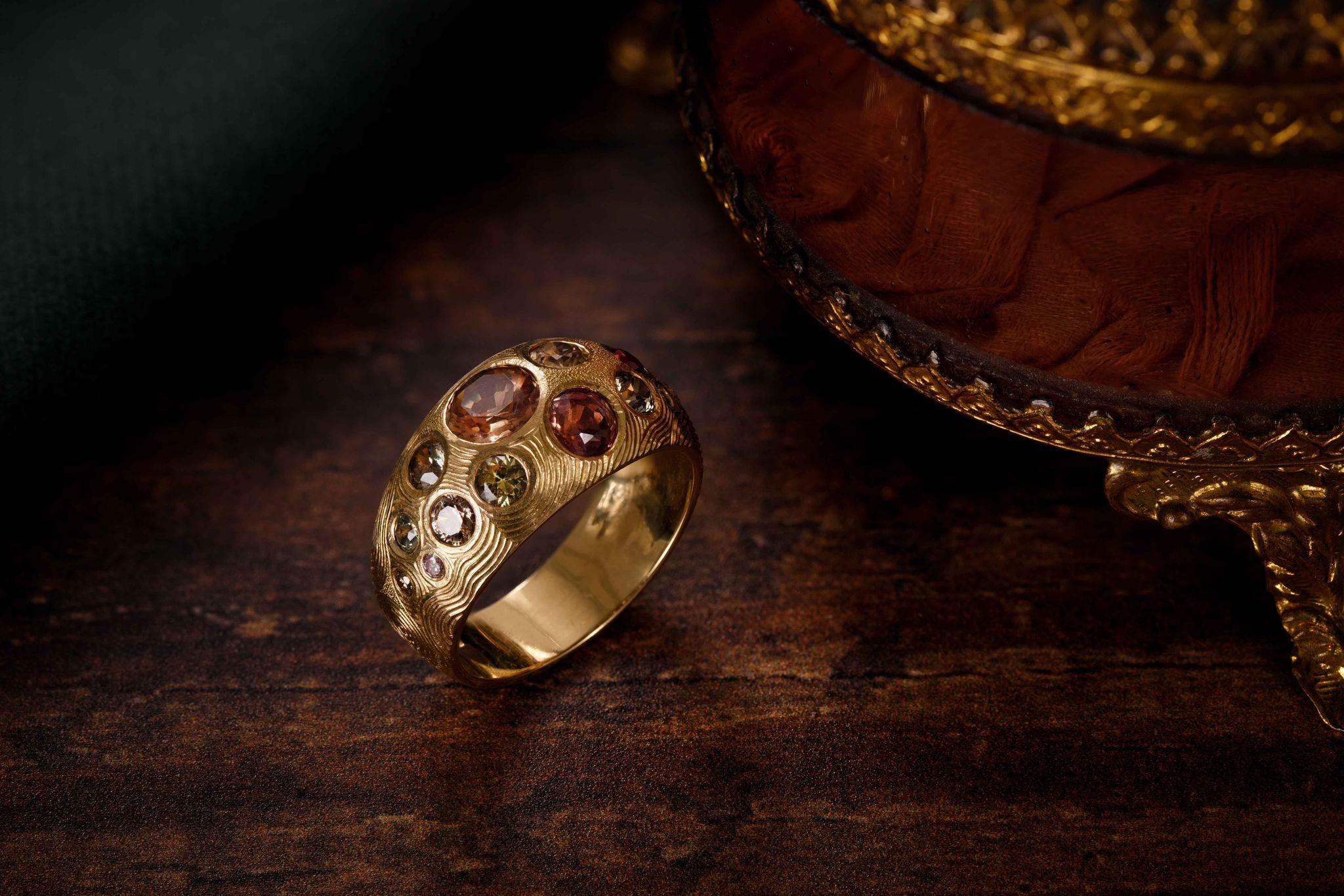 This Bombè ring was made, engraved and set entirely by hand. It is a one of a kind piece made by Master Goldsmith Ford Hallam Kinko Shi from The Remarkable Goldsmiths.