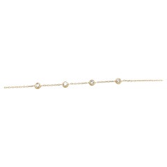 Pulsera de oro amarillo de 14 ct engastada con 4 diamantes brillantes redondos